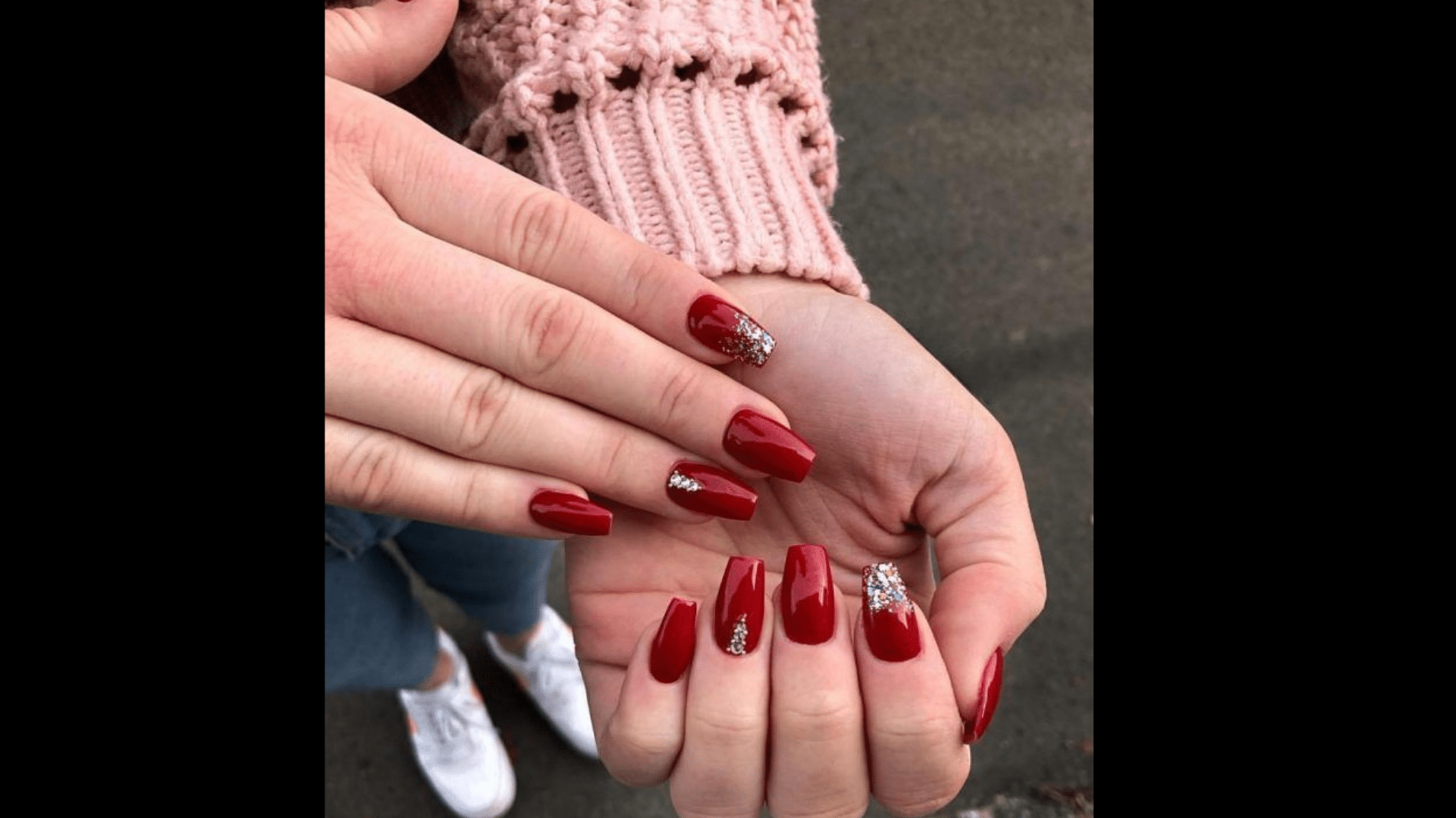 Dark red nails with rhinestone accents
