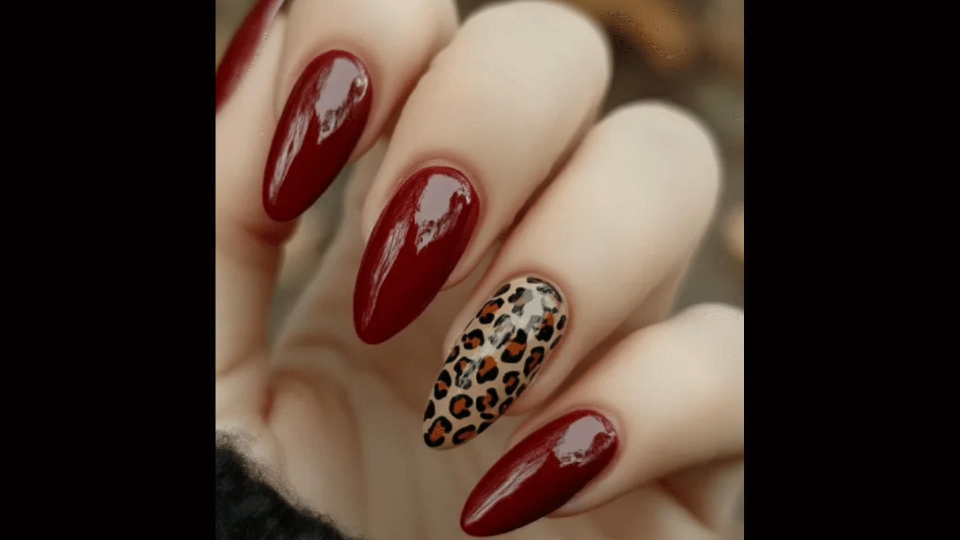 Red nails with animal print accents