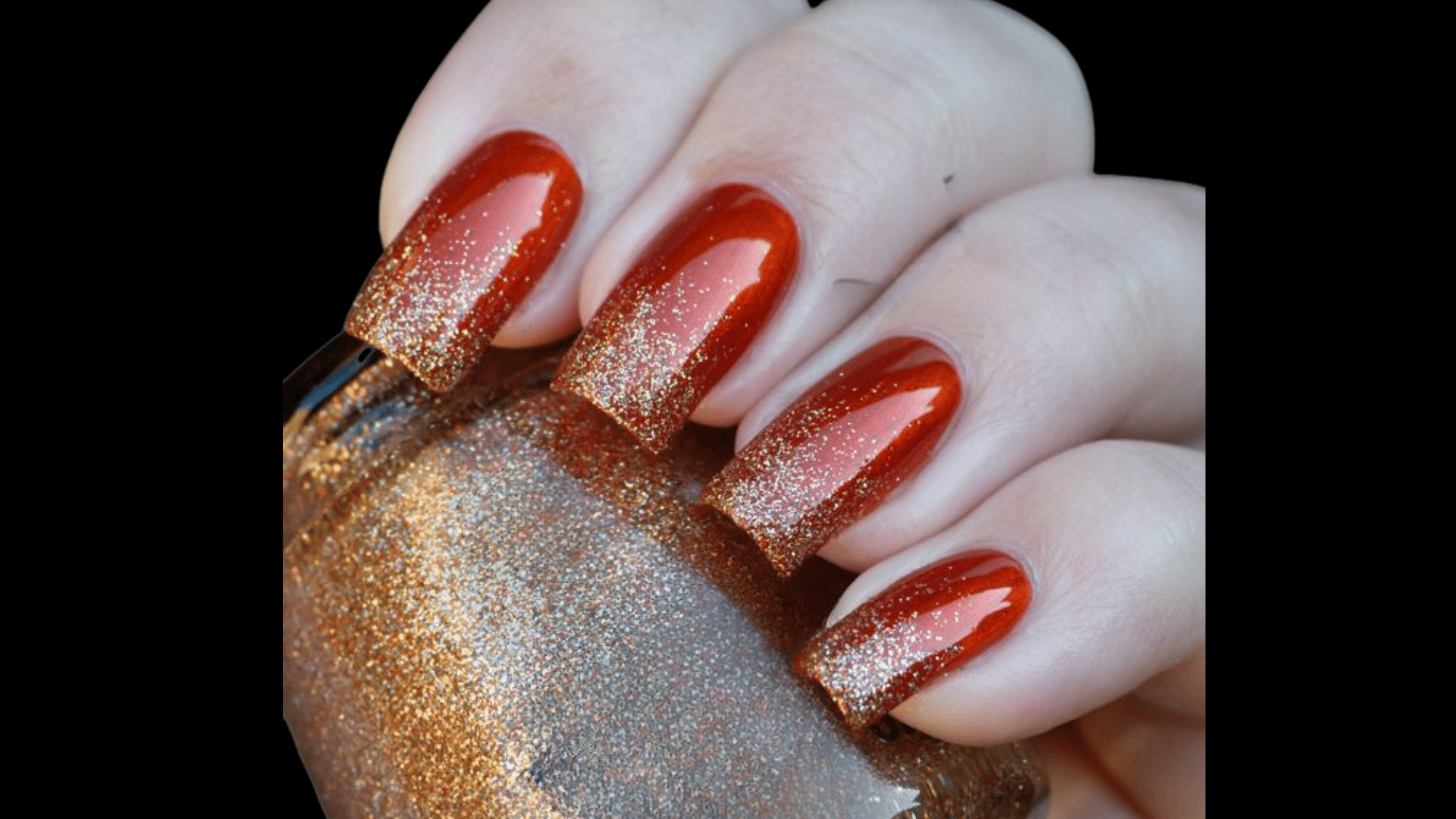 Red nails with glitter gradient at tips