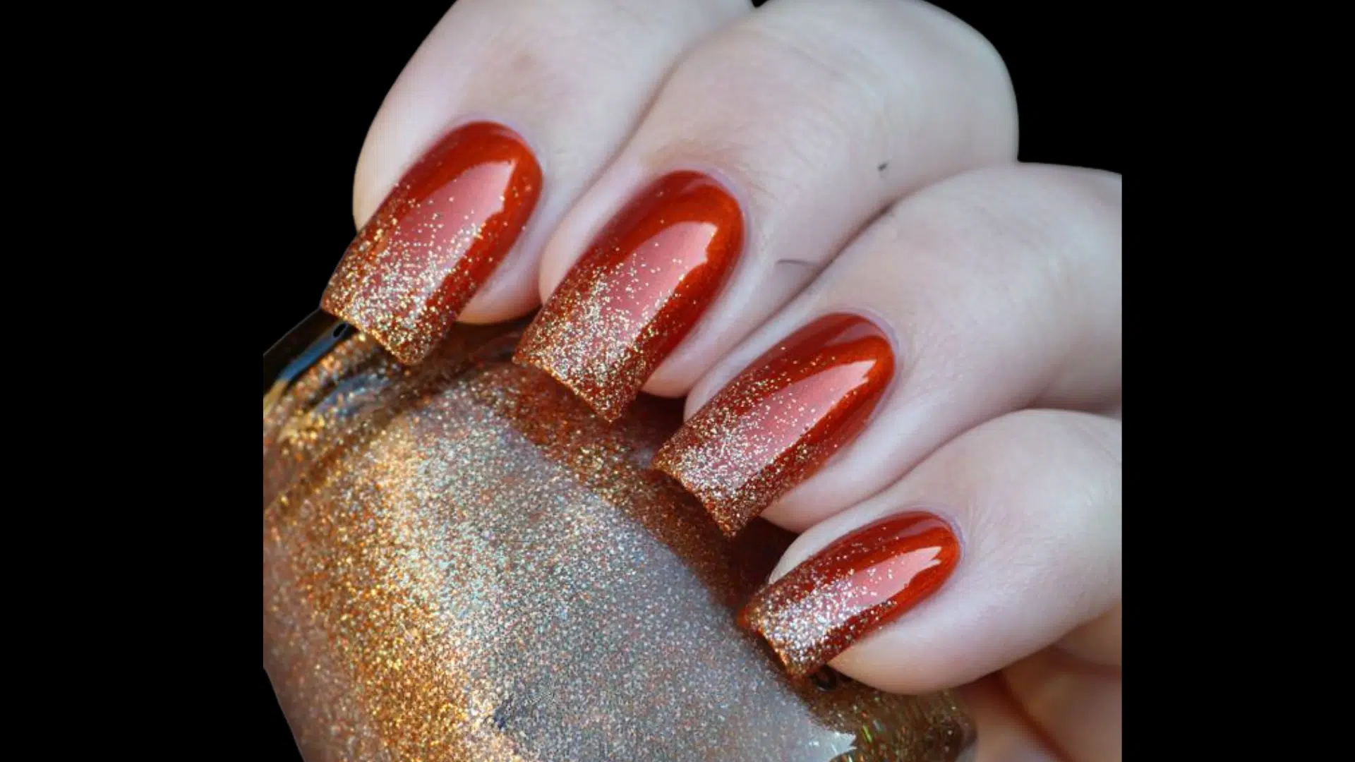 Red nails with glitter gradient at tips