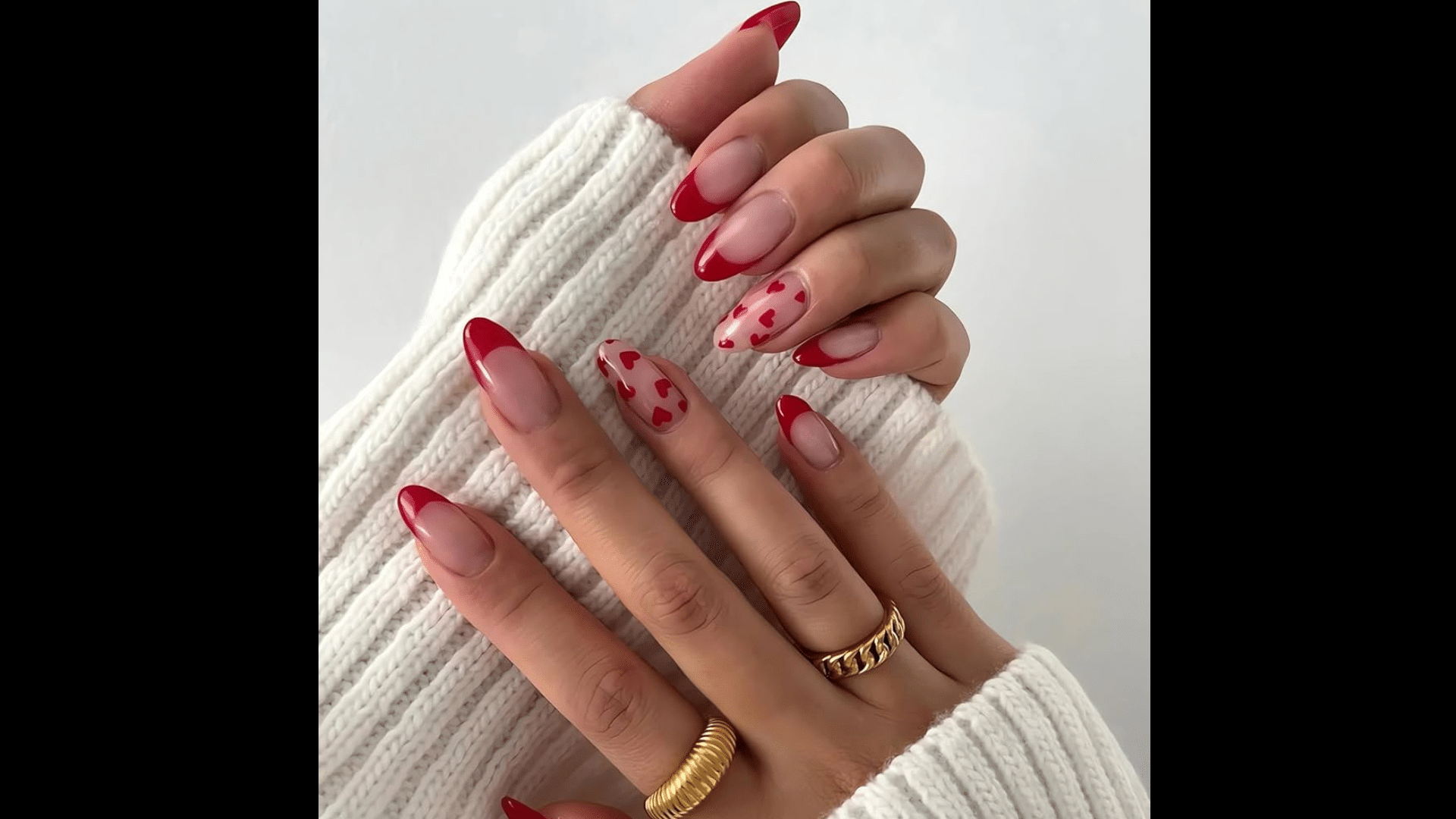 Red nails with heart designs