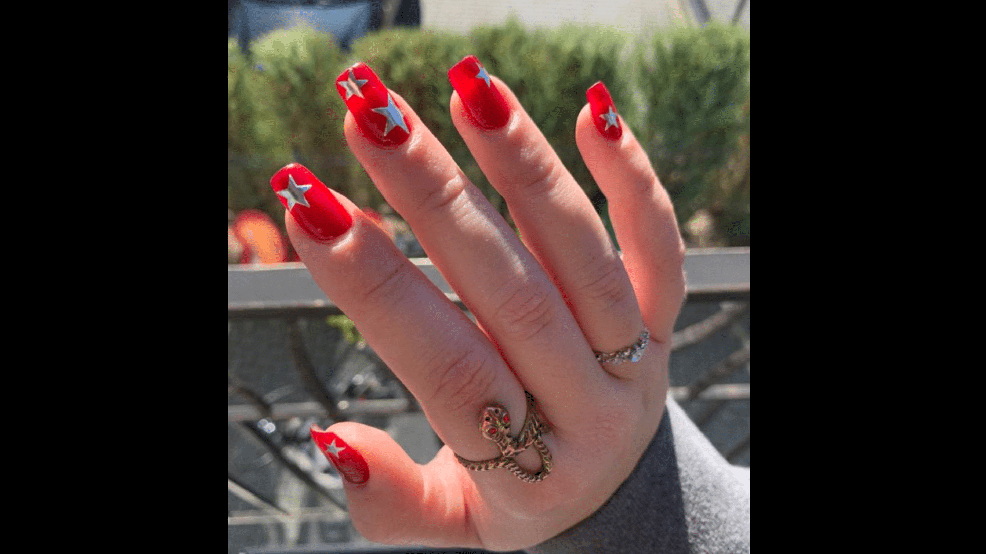 Red nails with tiny silver stars