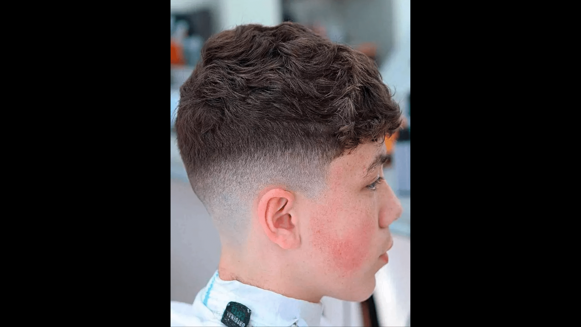 10. Comb Over with Mid Skin Fade