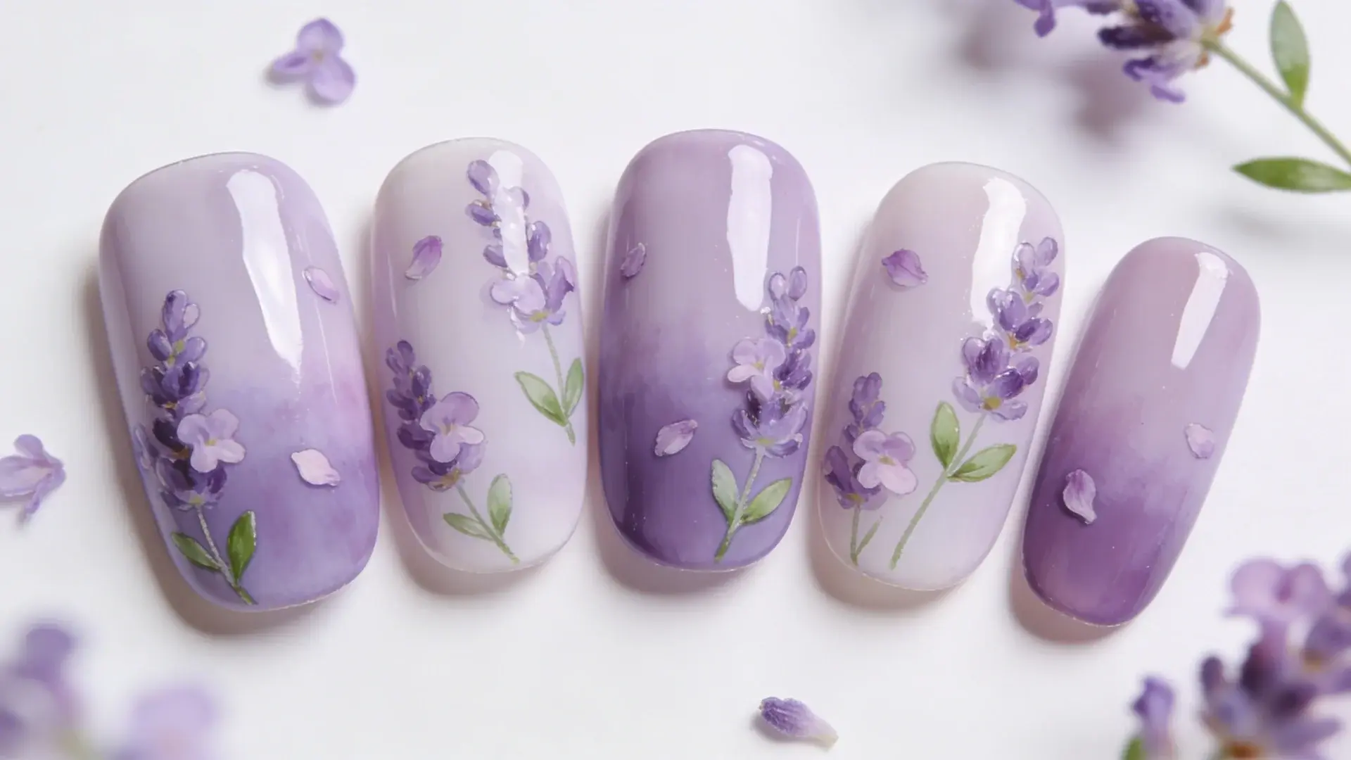 Lavender floral nail art design with purple gradient nails and delicate hand painted flower details