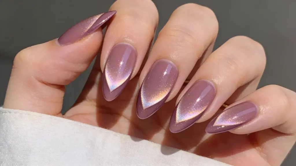 Mauve almond shaped nails with iridescent chrome accent tips creating a soft shimmer effect on glossy mauve manicure