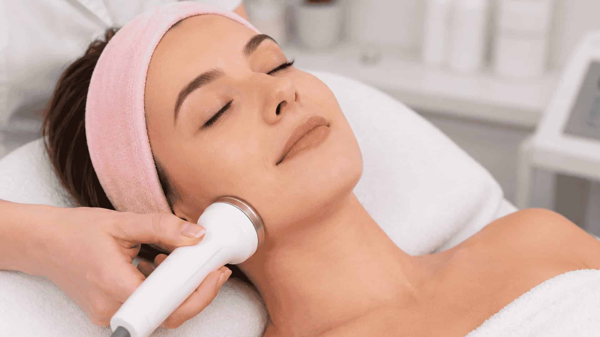 Close-up of a woman receiving a skin tightening facial treatment