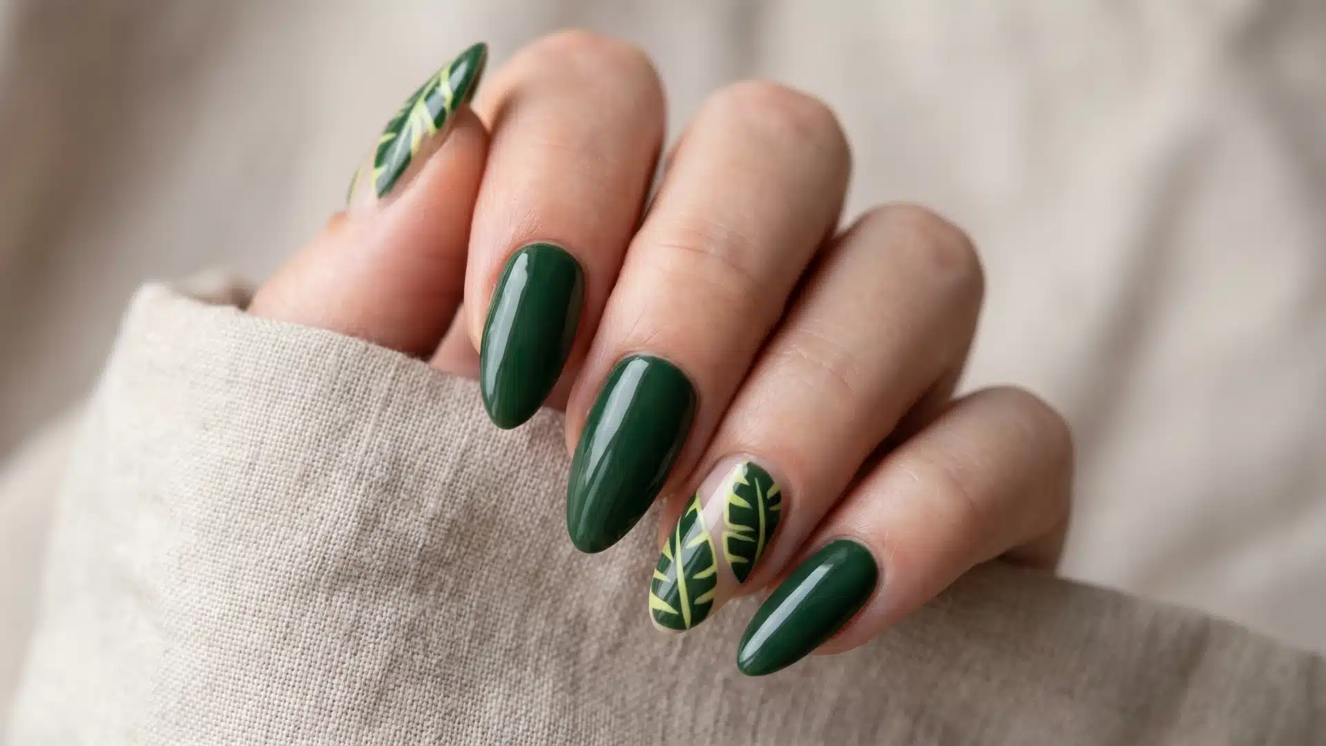 Glossy green nails with tropical leaf accent design on one finger (1) (1)