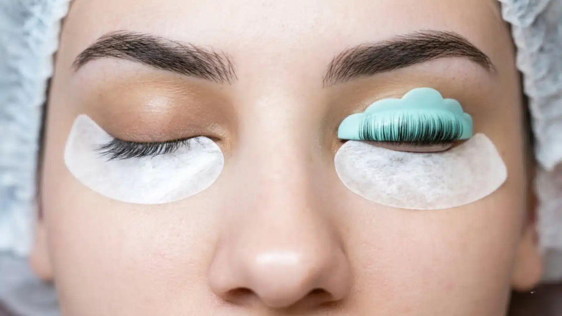 Lash lift treatment process with silicone shield placed on natural eyelashes during appointment