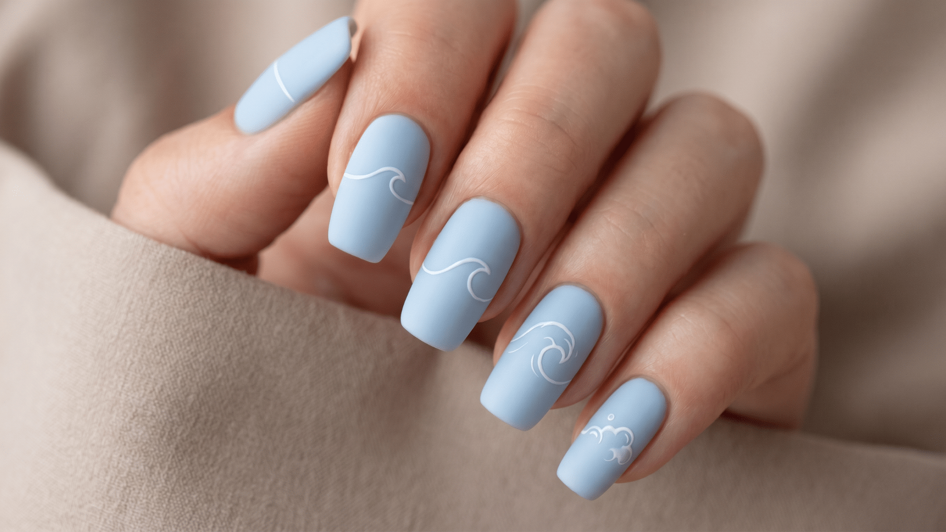 Matte pale blue nails with minimal white wave line art sequence design