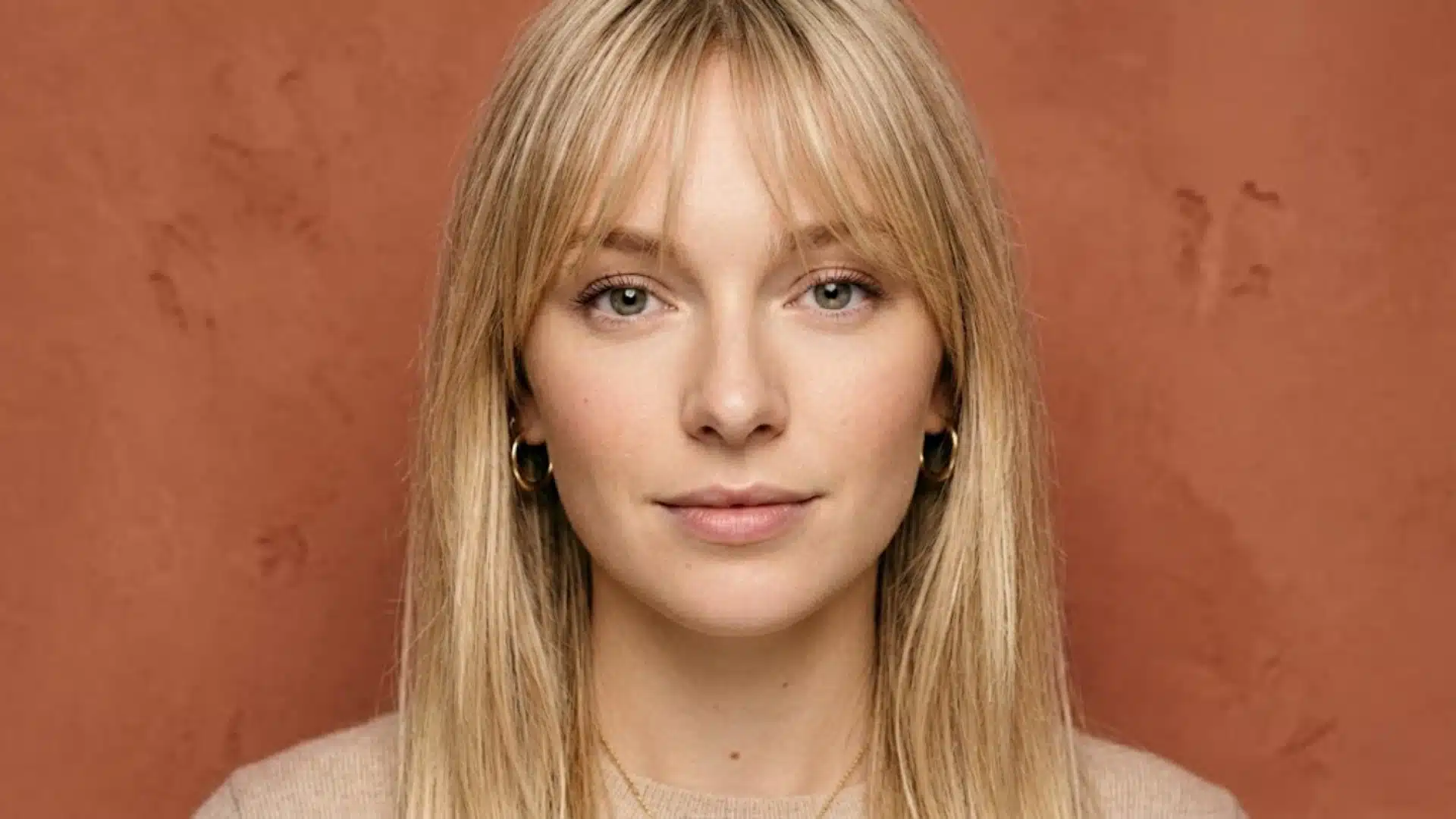 Woman with straight fine hair and wispy Bardot fringe hairstyle