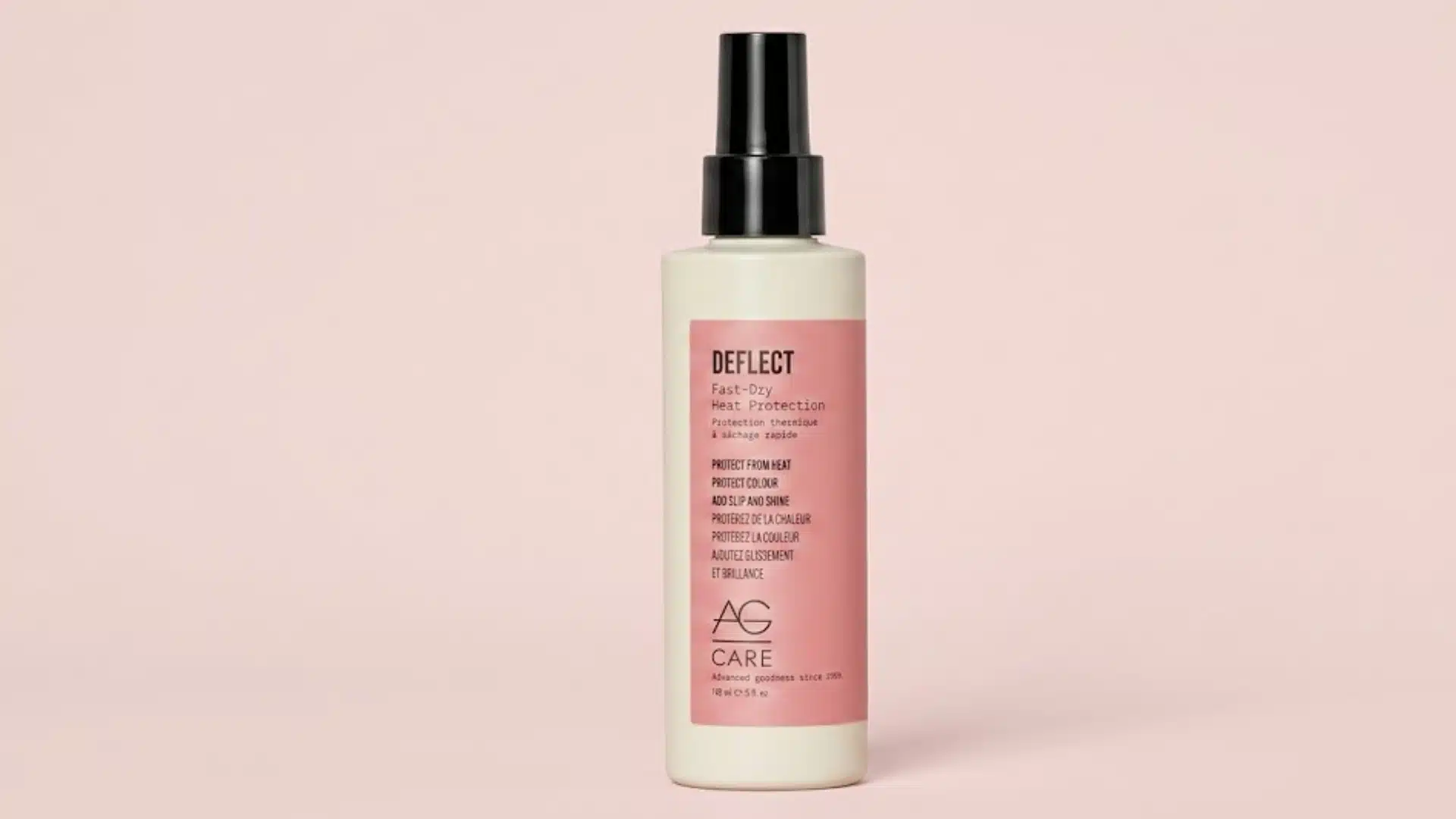 AG Care Deflect Fast Dry Heat Protection spray bottle on a soft pink background with clean studio lighting028
