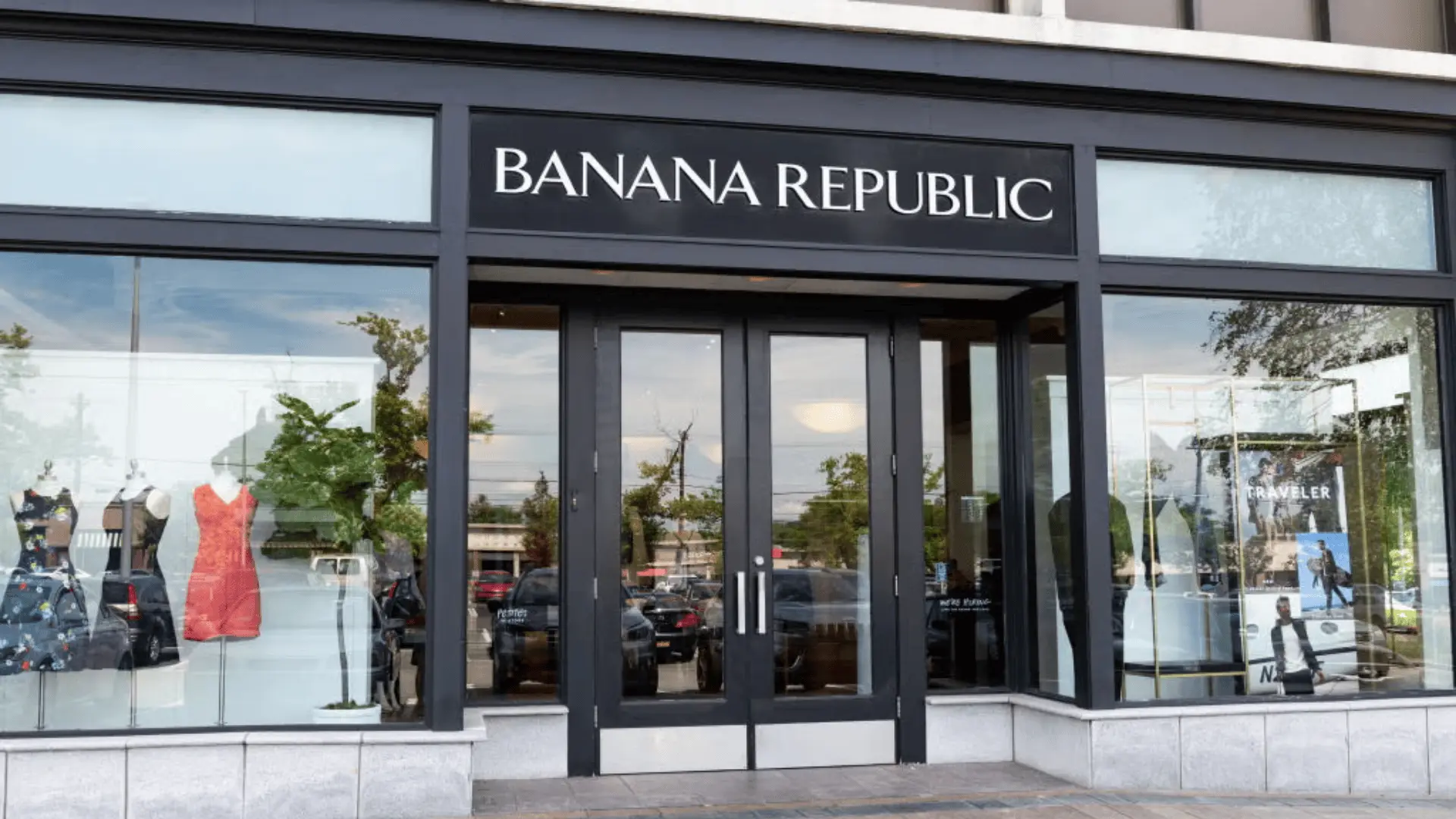 Banana Republic retail storefront with glass entrance, window displays, and visible clothing inside