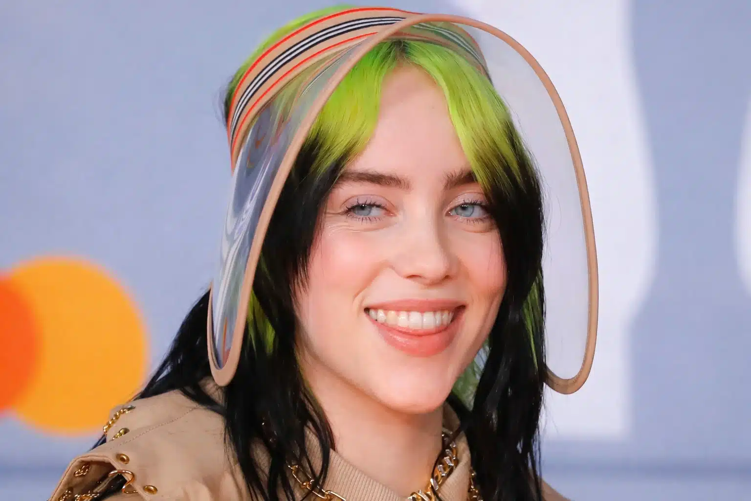 Billie Eilish with soft cool-toned makeup and black hair with green highlights, representing light summer palette with airy contrast