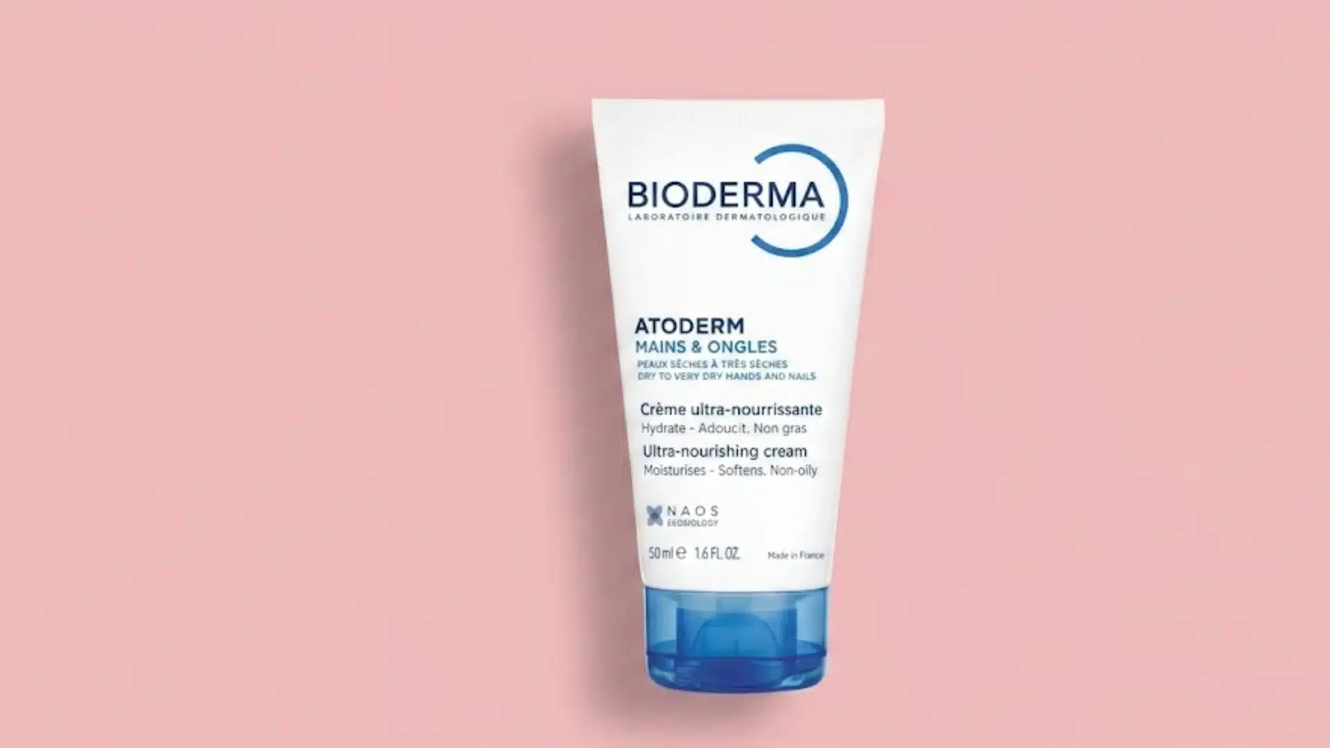 Bioderma Atoderm Hands and Nails ultra nourishing hand cream tube on a soft pink background