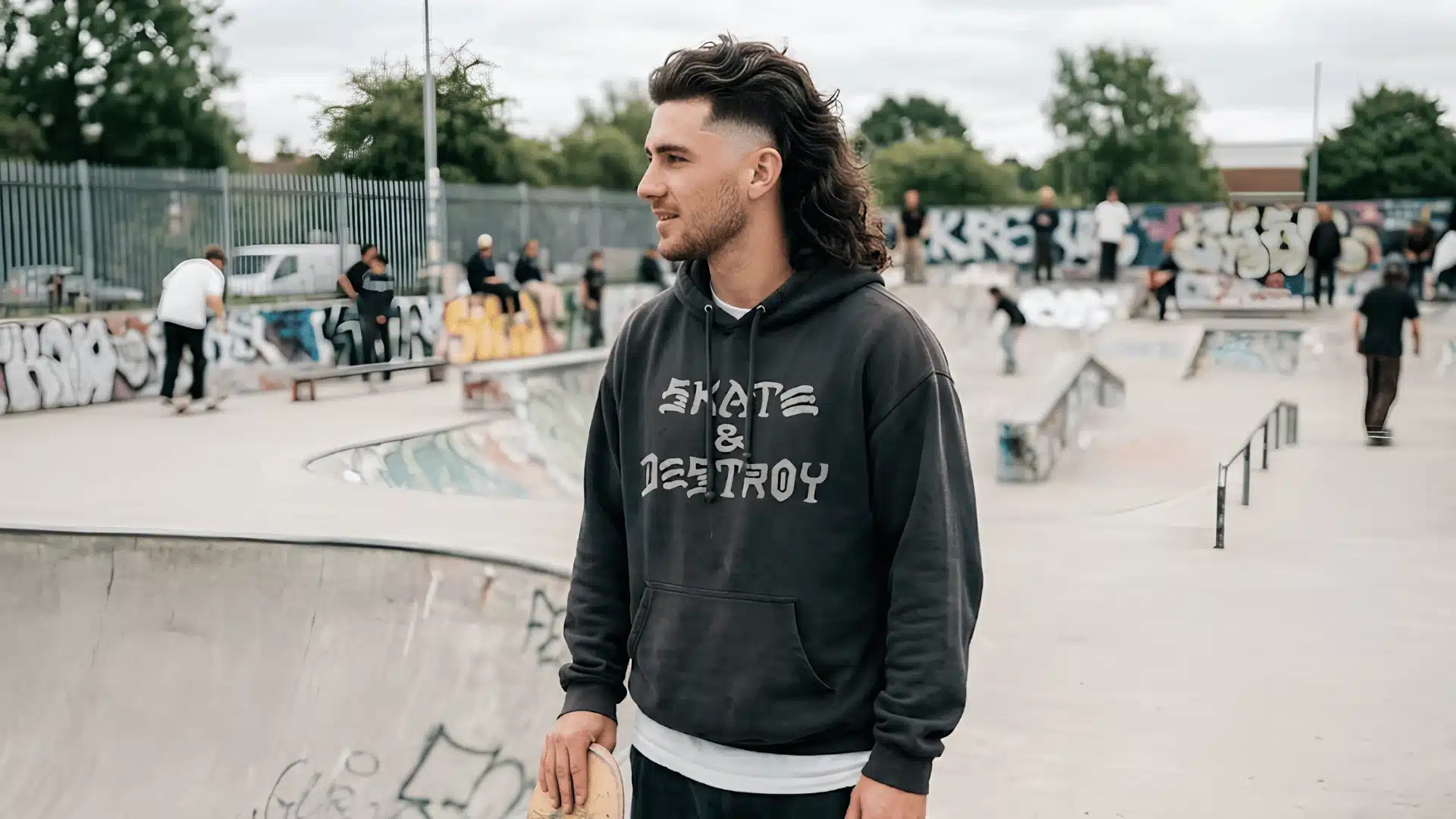 Burst skin fade mullet with rounded fade and thick wavy texture