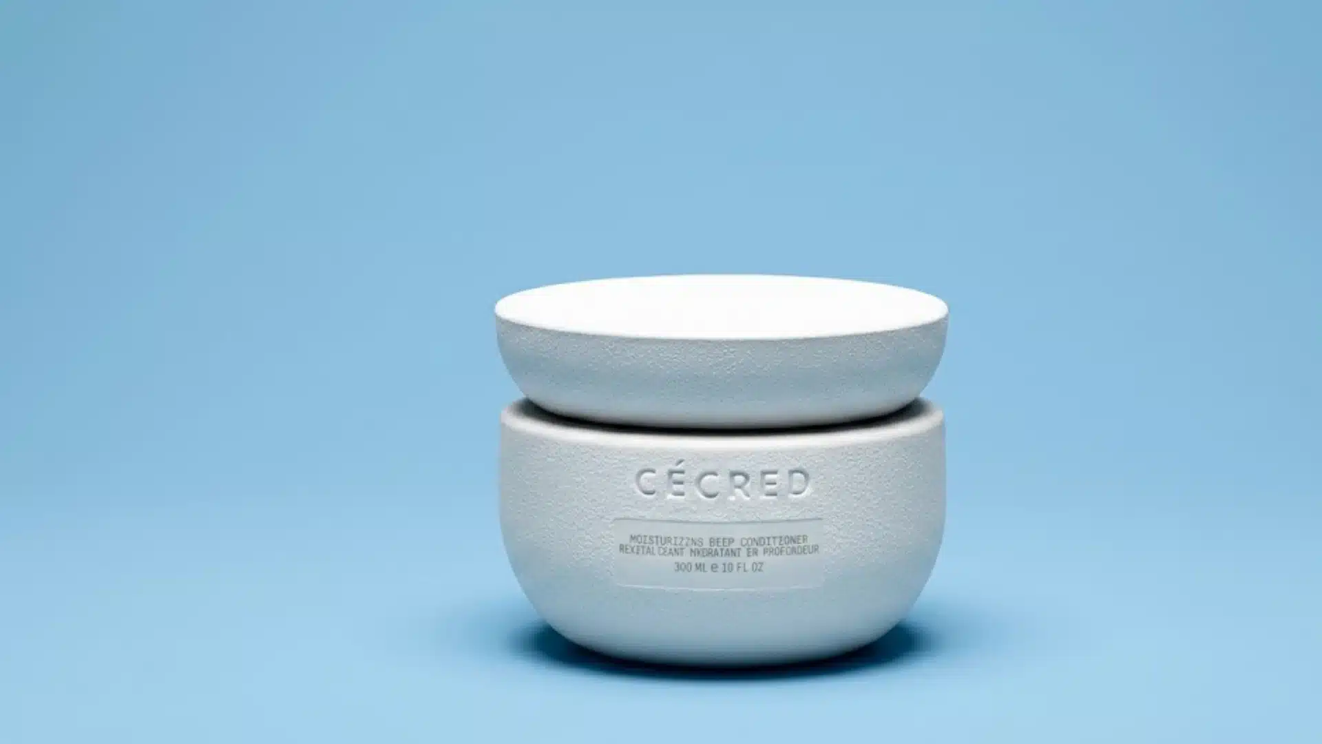 Cecred Moisturizing Deep Conditioner jar on a blue background showcasing a hydrating hair treatment for dry hair and moisture repair