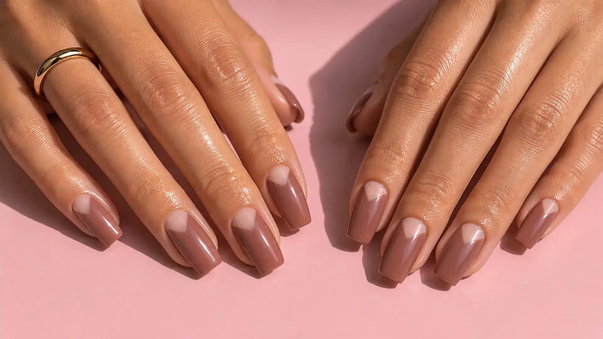 Coffin nails with a negative space triangle cutout at the base revealing bare natural nail