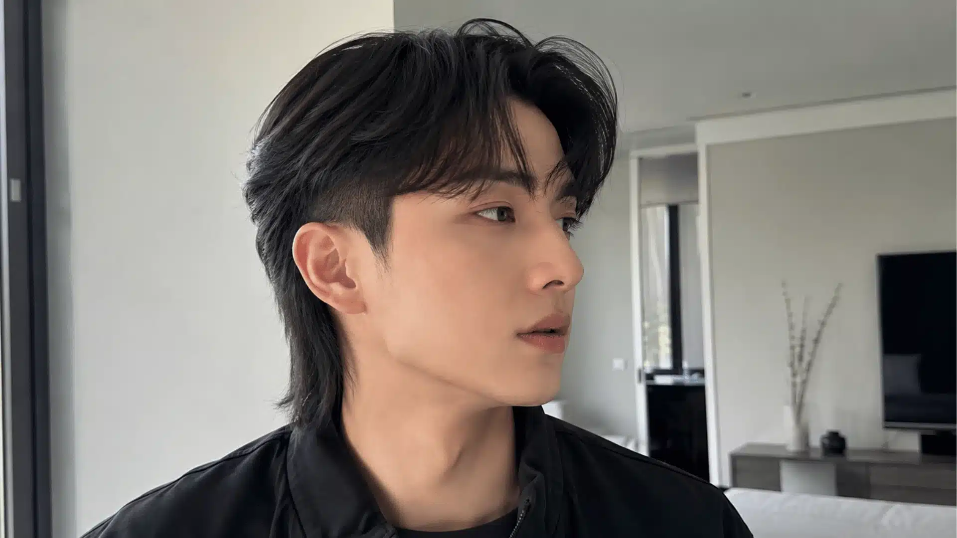 Comma hair skin fade mullet with curved fringe