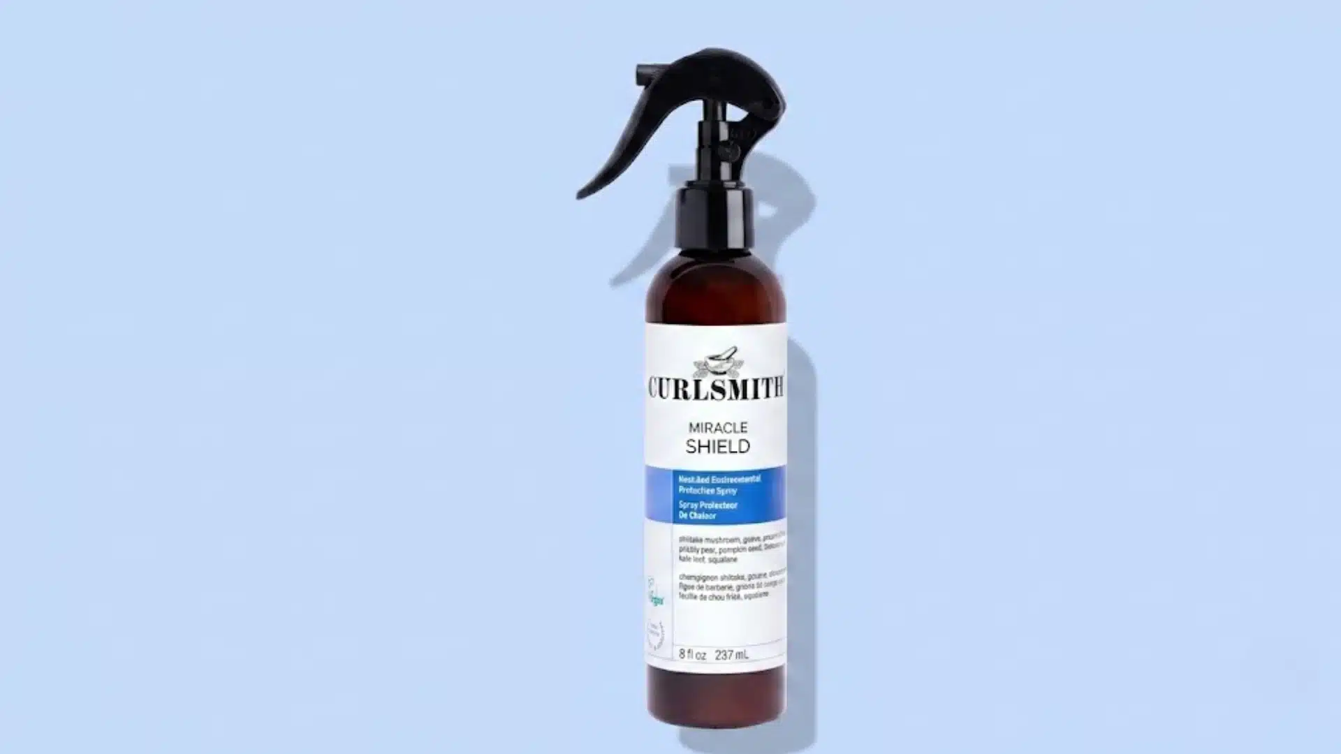Curlsmith Miracle Shield Heat Protection Spray bottle with trigger nozzle on a light blue background showing UV and heat protection product