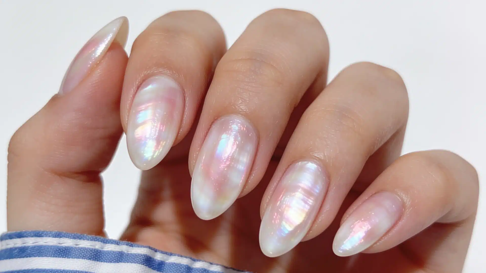 Frosted chrome glazed almond nails with pink and blue iridescent shine