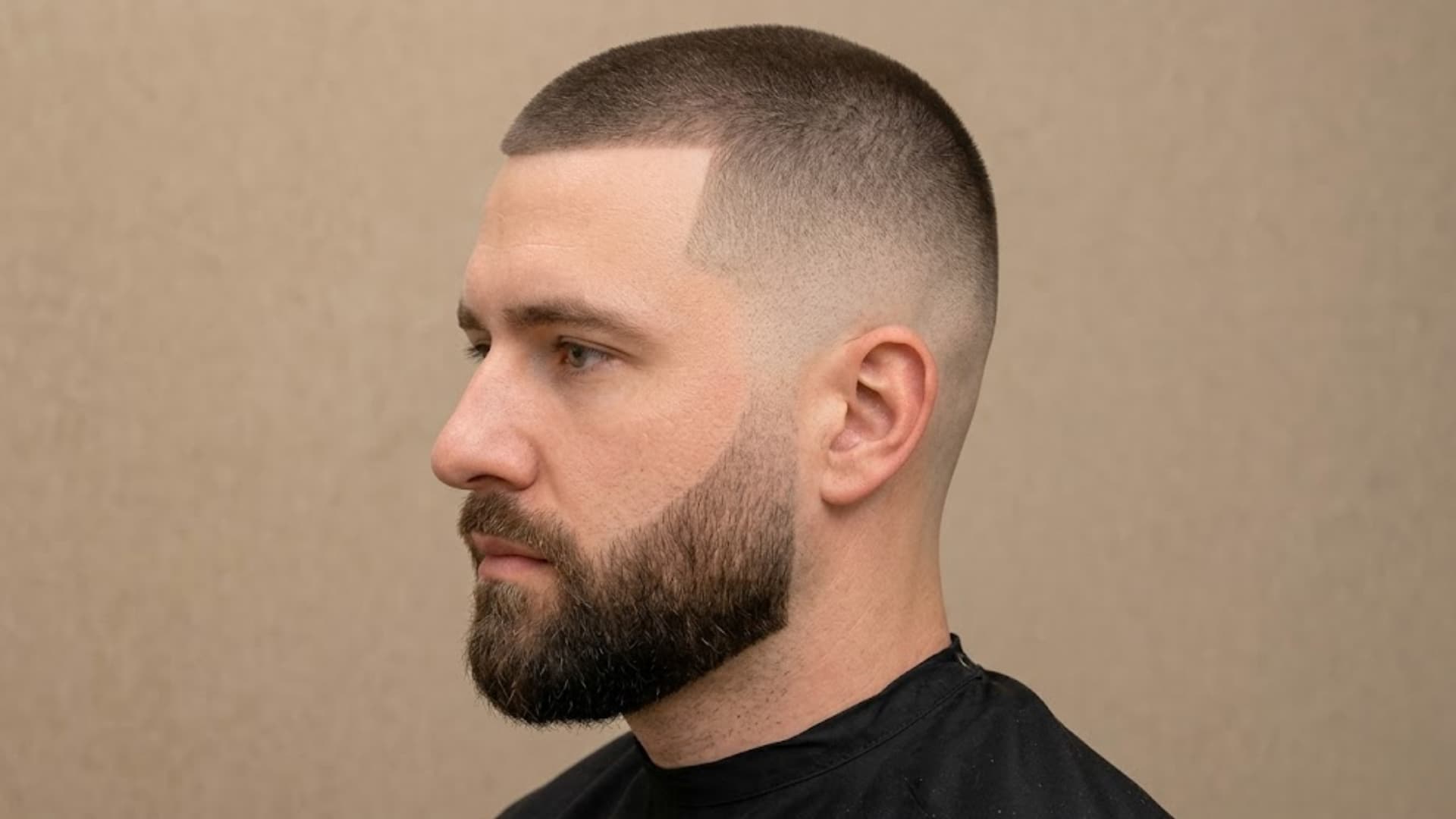High Fade with Short Top with sharp hairline and full beard for a clean modern men’s haircut look