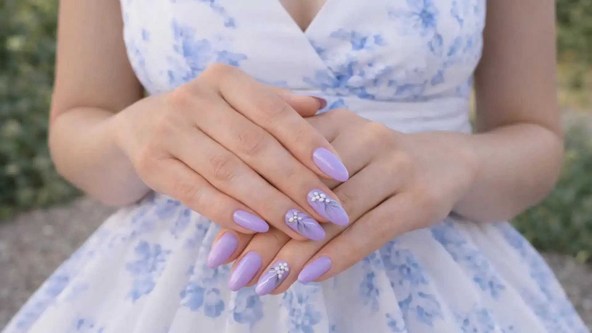 Lavender bridesmaids nails with small floral nail art paired with floral dress showing soft romantic and delicate nail style