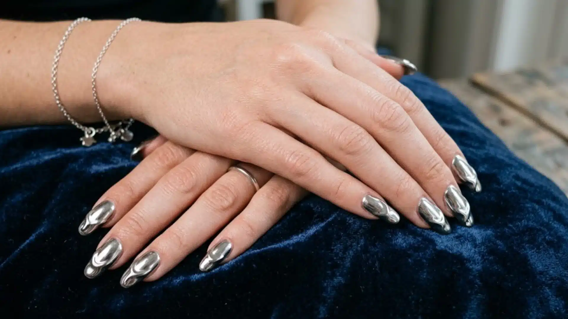 Liquid Metal Tips in silver mirror finish, high shine metallic look, bold statement manicure