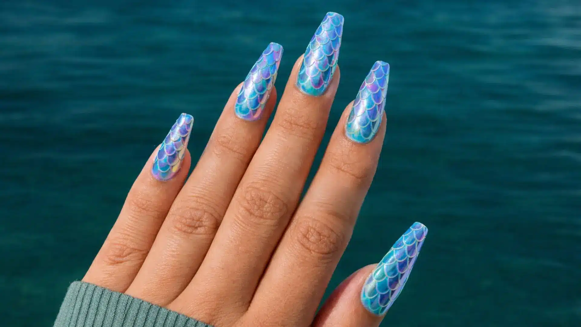 Mermaid scale chrome nails in teal and purple tones, textured ocean inspired manicure for summer trends