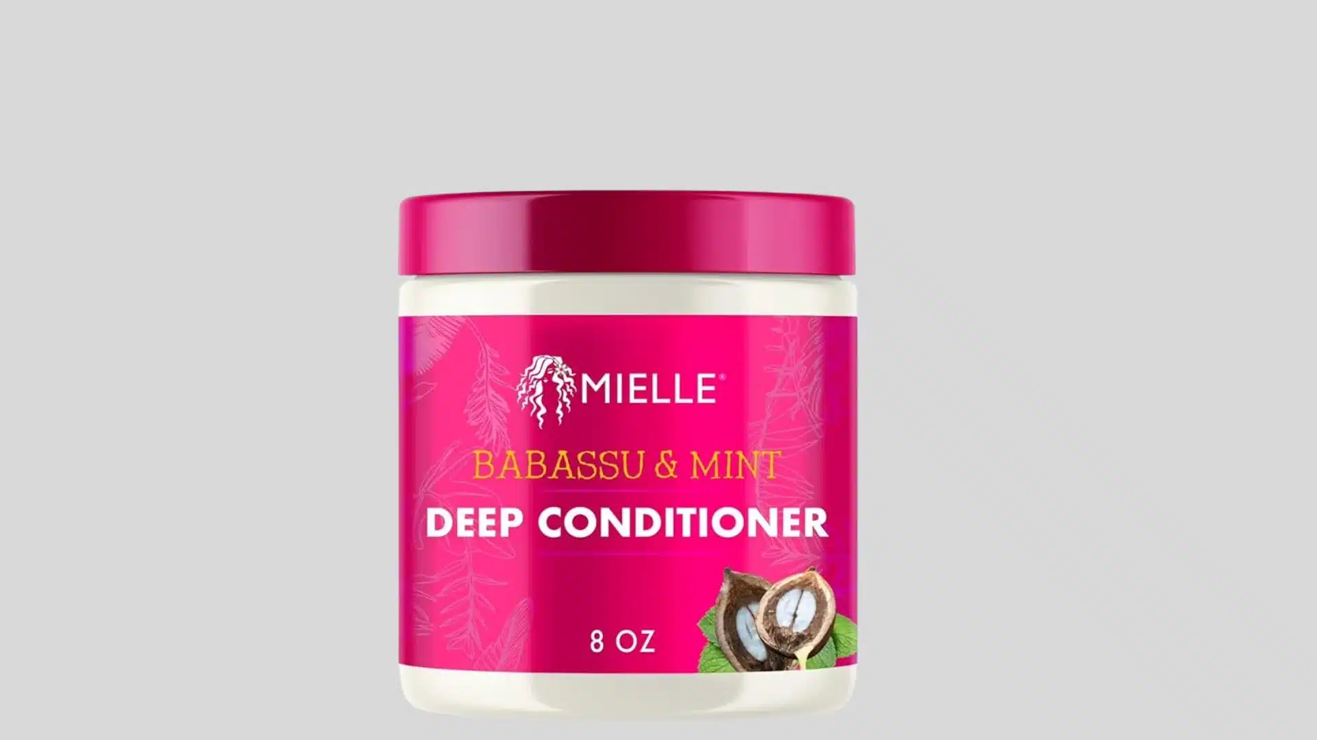 Mielle Babassu & Mint Deep Conditioner jar with a bright pink label and lid on a gray background