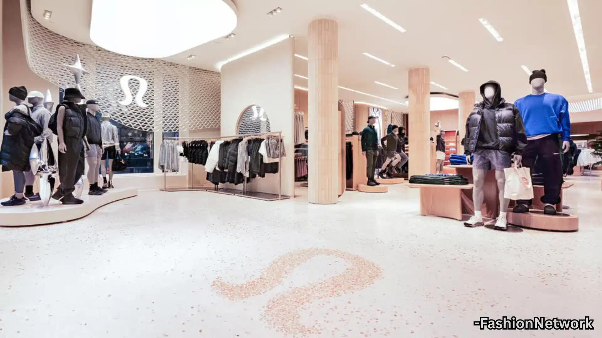 Modern Lululemon store interior with athletic apparel displays, mannequins, bright lighting, and clean design layout