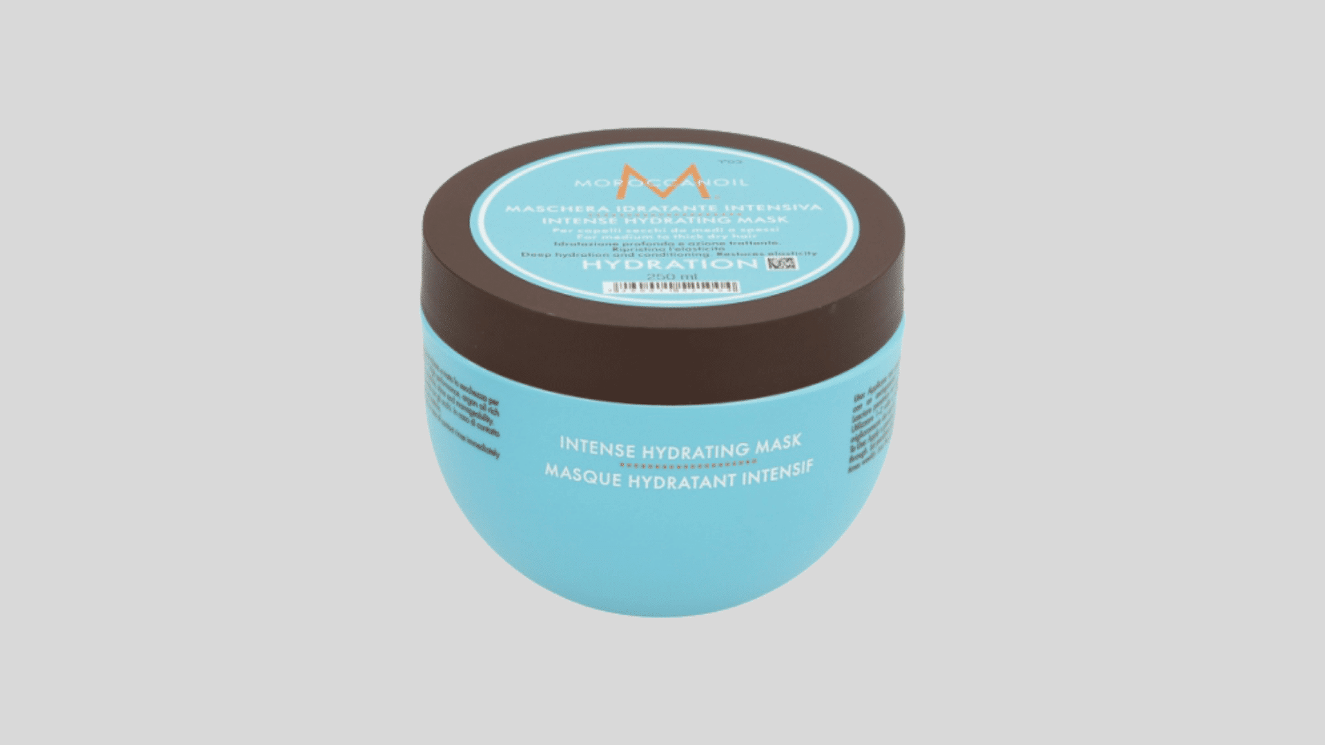 Moroccanoil Intense Hydrating Mask jar with blue container and brown lid on a light gray background
