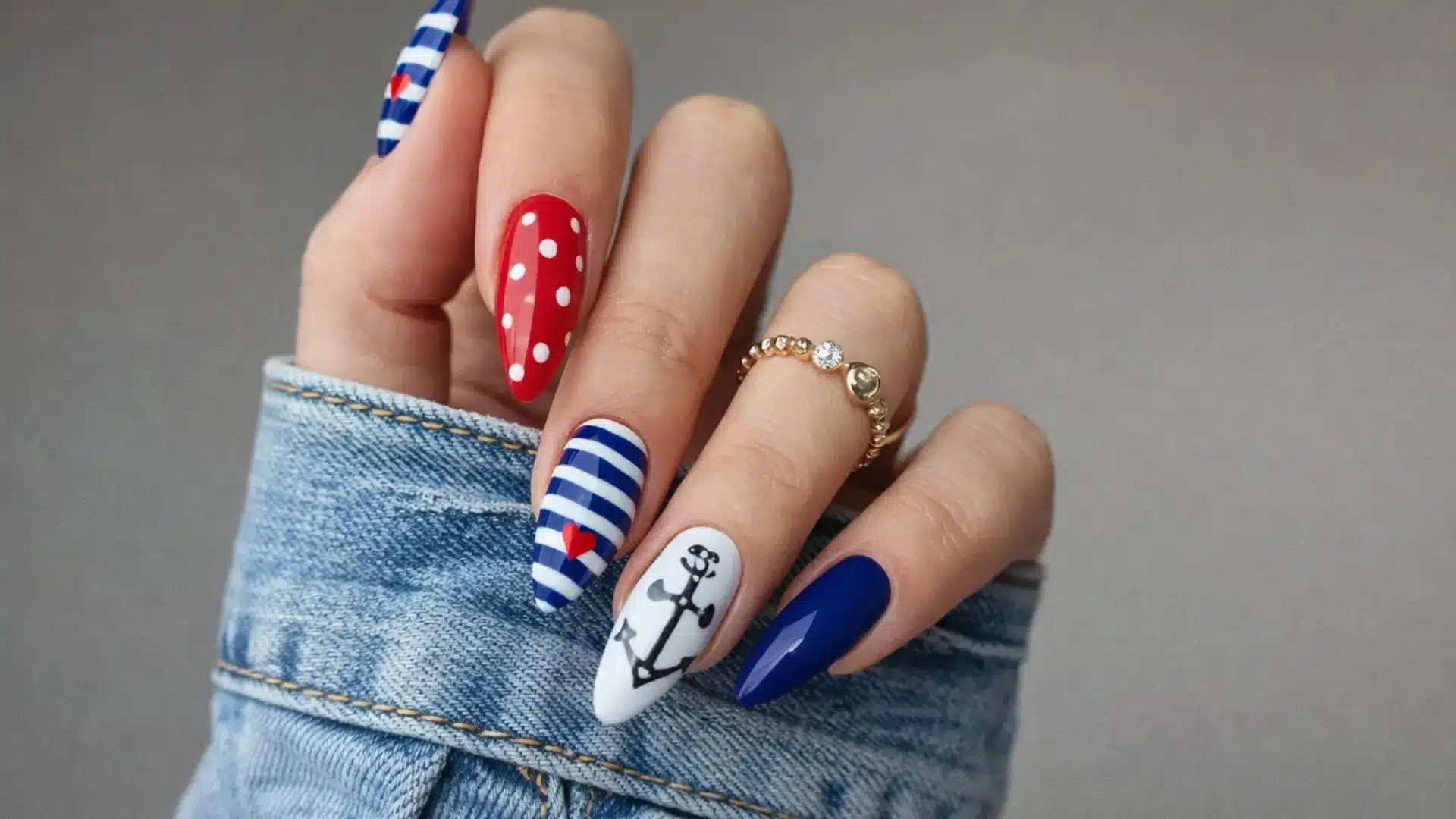 Nautical themed nails with anchors, stripes, and polka dots, marine inspired manicure for coastal fashion