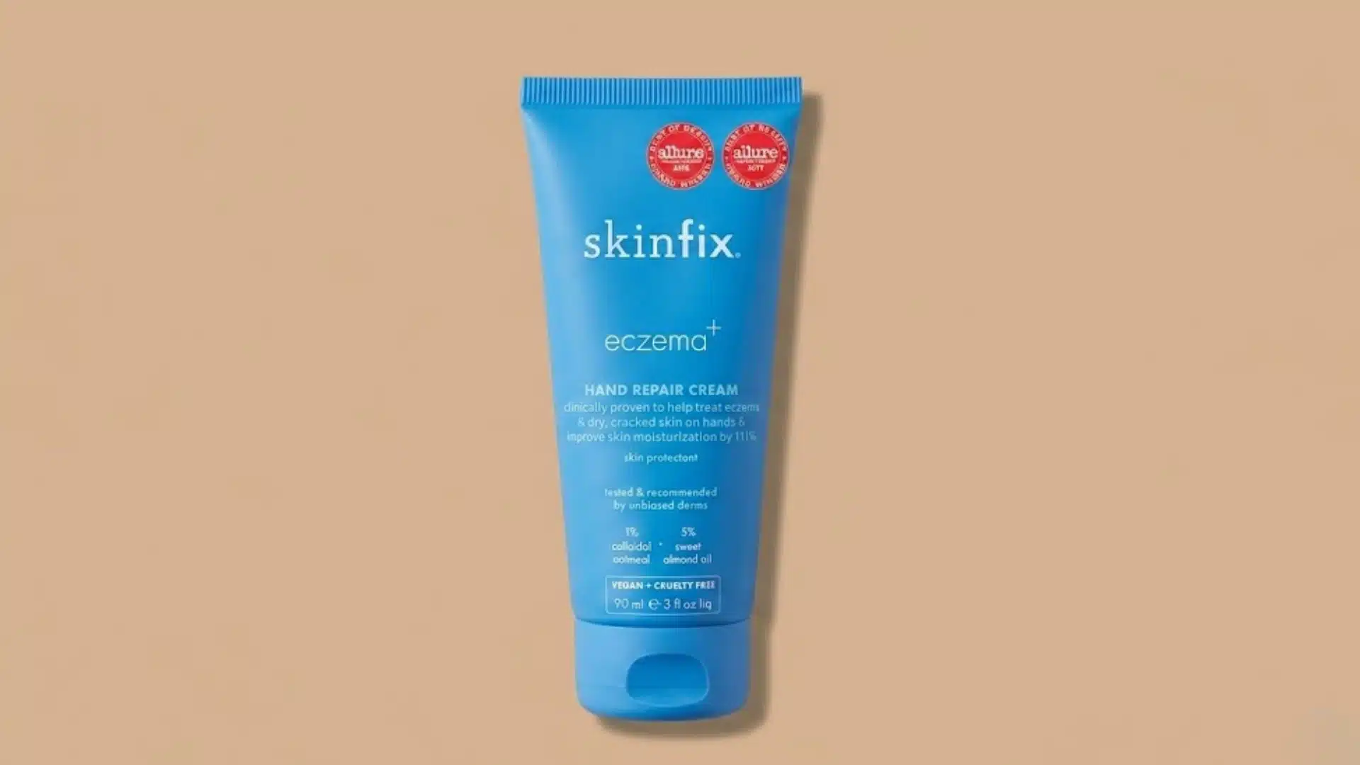 Skinfix Eczema+ Hand Repair Cream tube for dry, cracked hands on a beige background with award badges