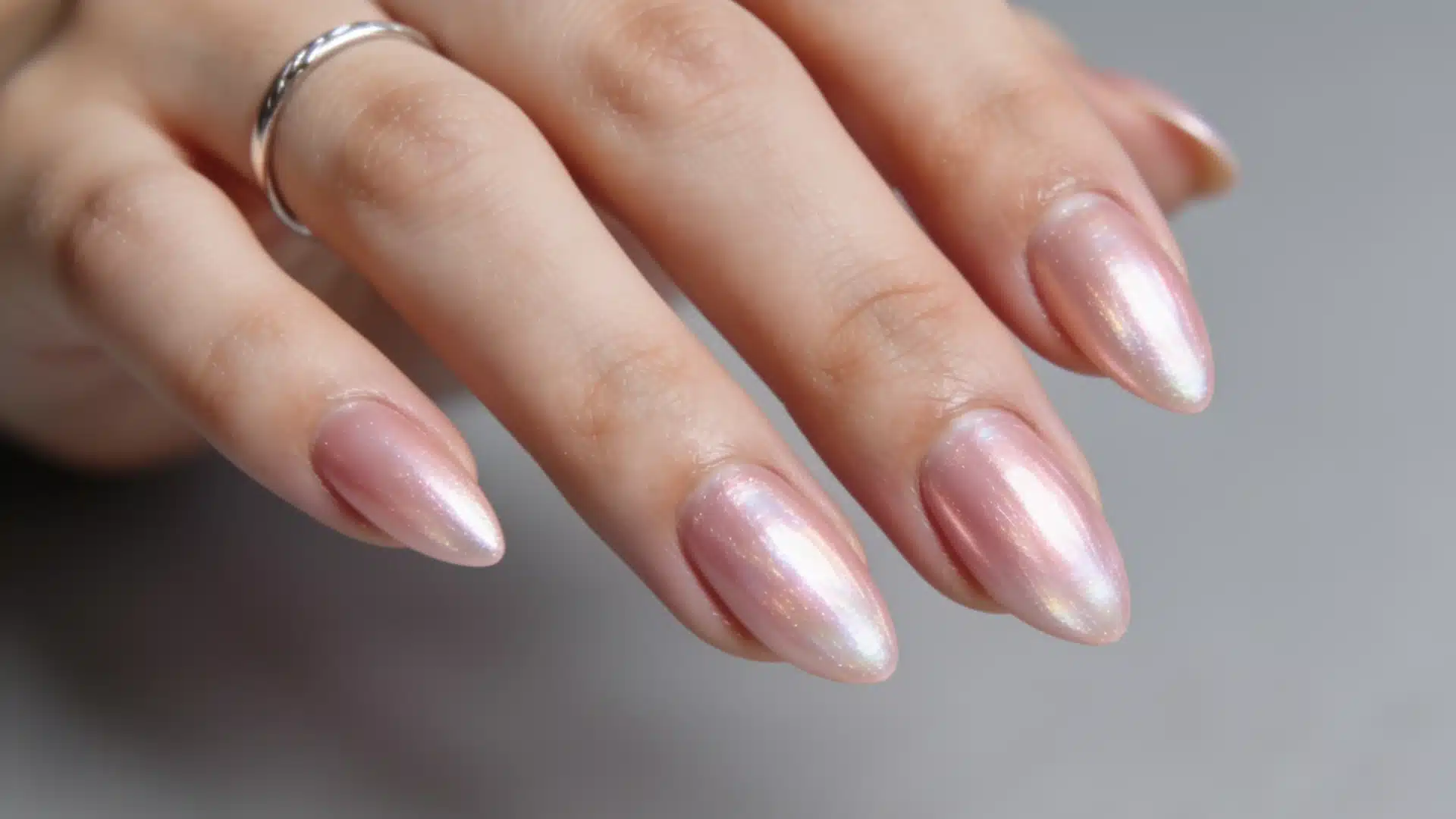 Strawberry glazed donut nails with pink pearl chrome on almond shaped nails