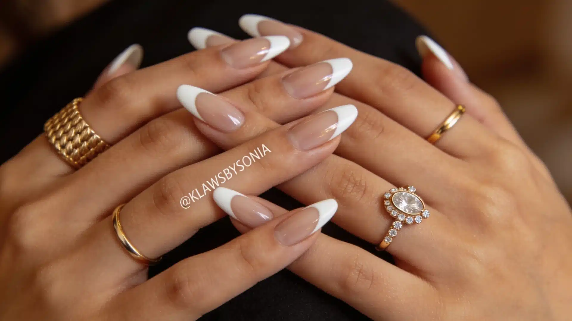Vanilla French glaze almond nails with white tips and gold rings
