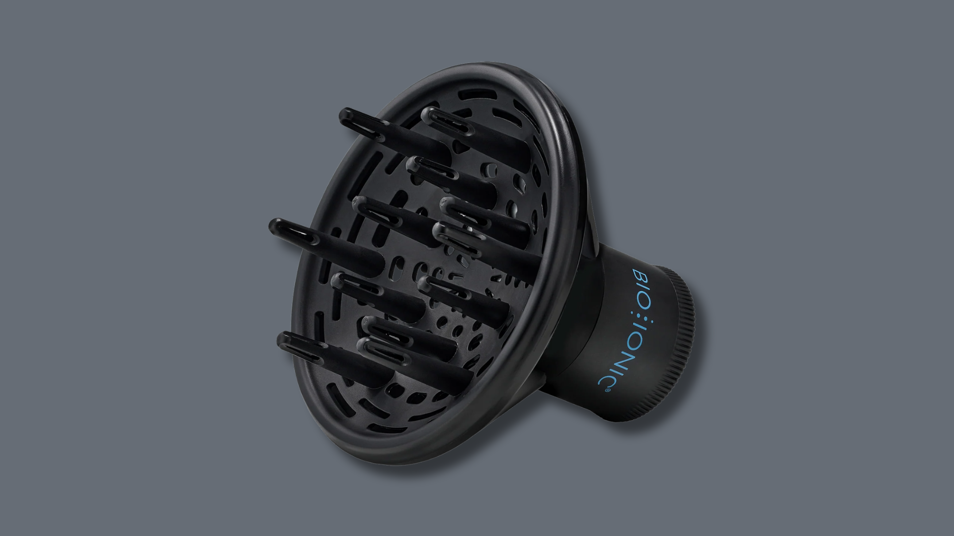 Black Bio Ionic hair dryer diffuser attachment with long prongs, isolated on a dark gray background