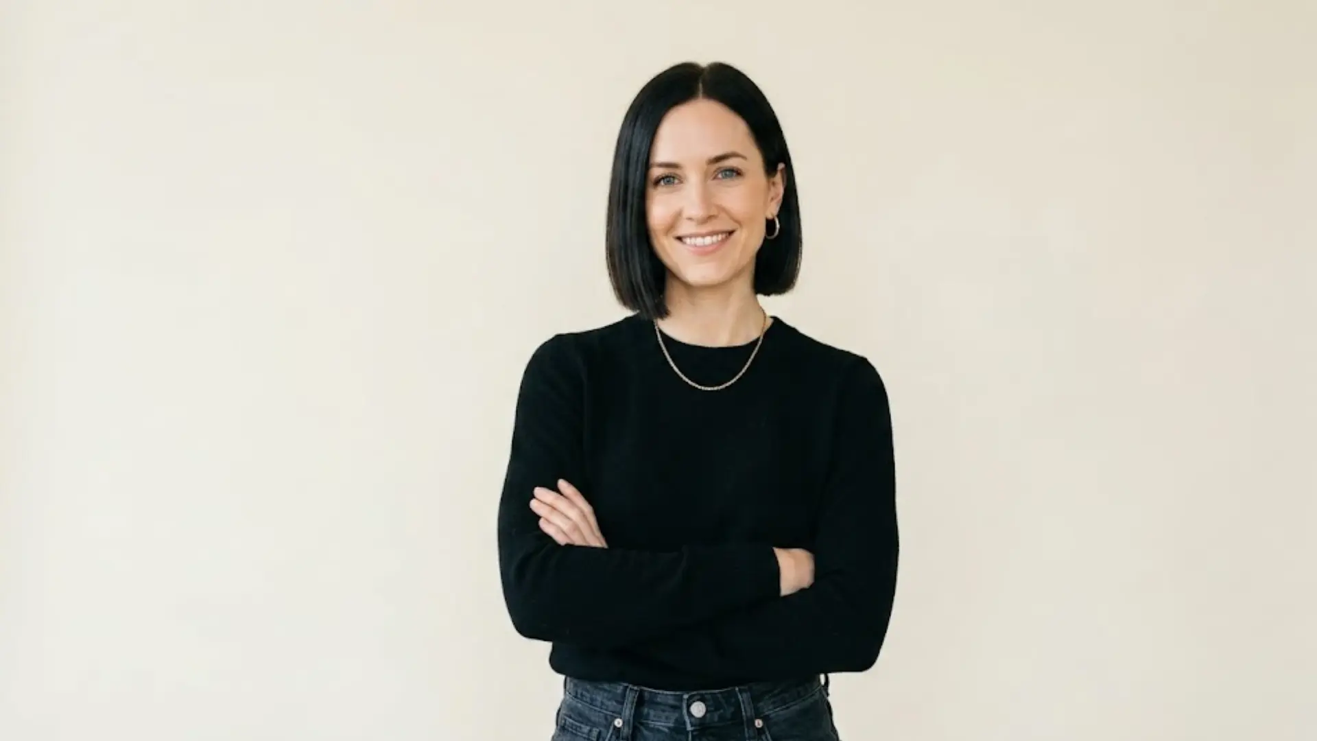 Chin-Length Bob haircut standing against a beige wall