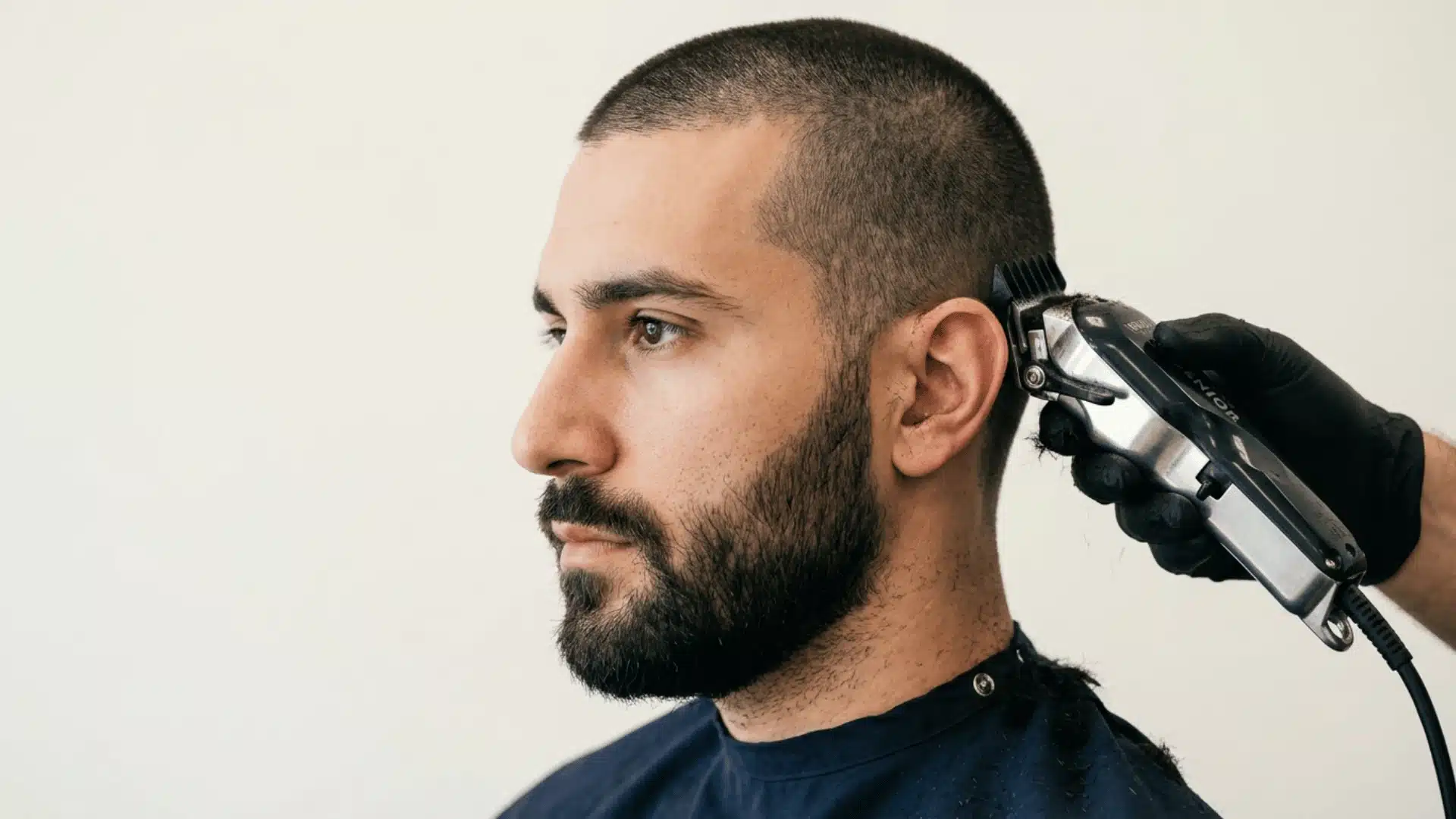 Man with a Number 5 buzz cut featuring thick textured hair and fuller scalp coverage