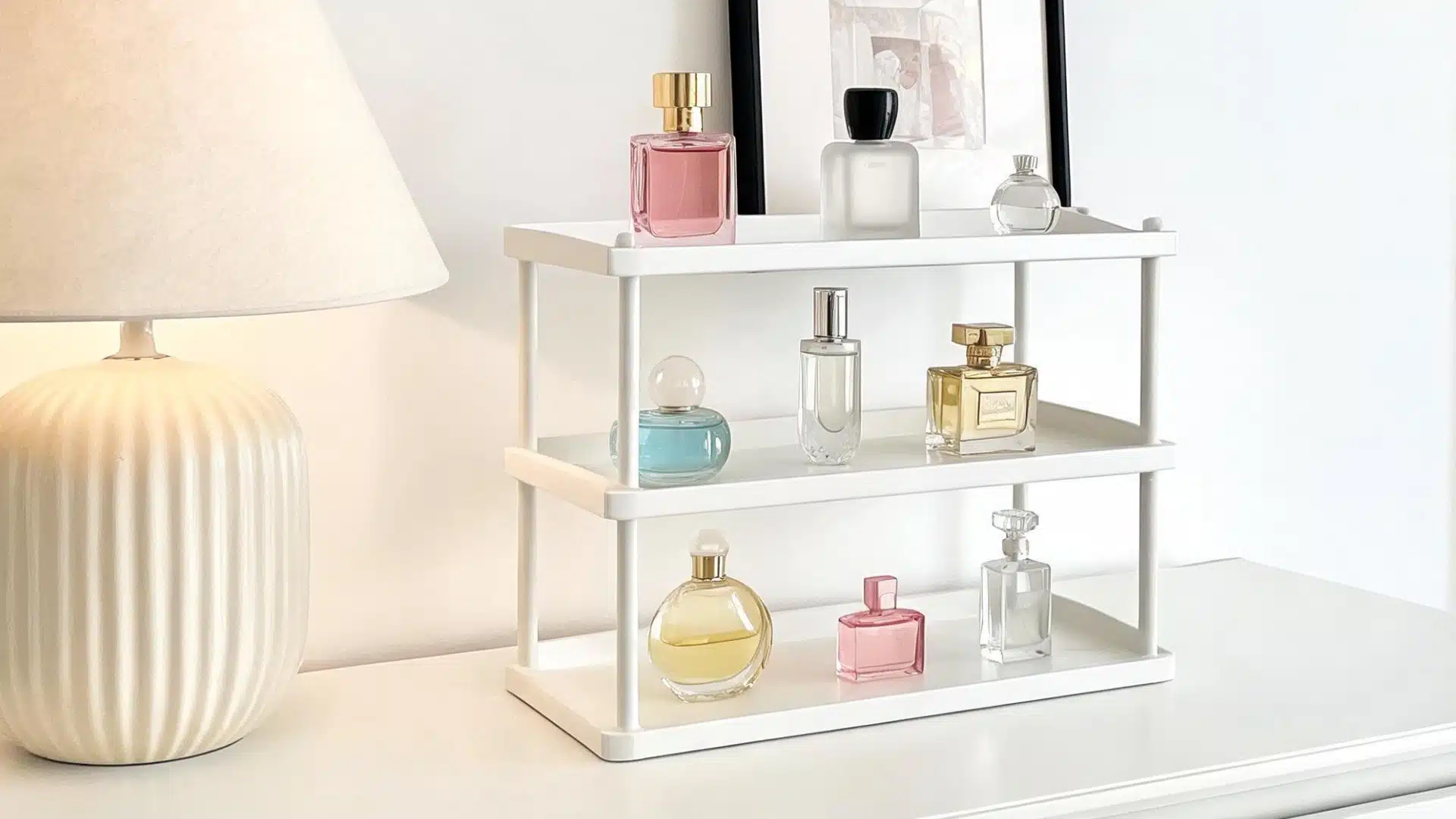 Perfume bottles displayed on a white shelf beside a lamp, showing fragrance storage and daily scent options