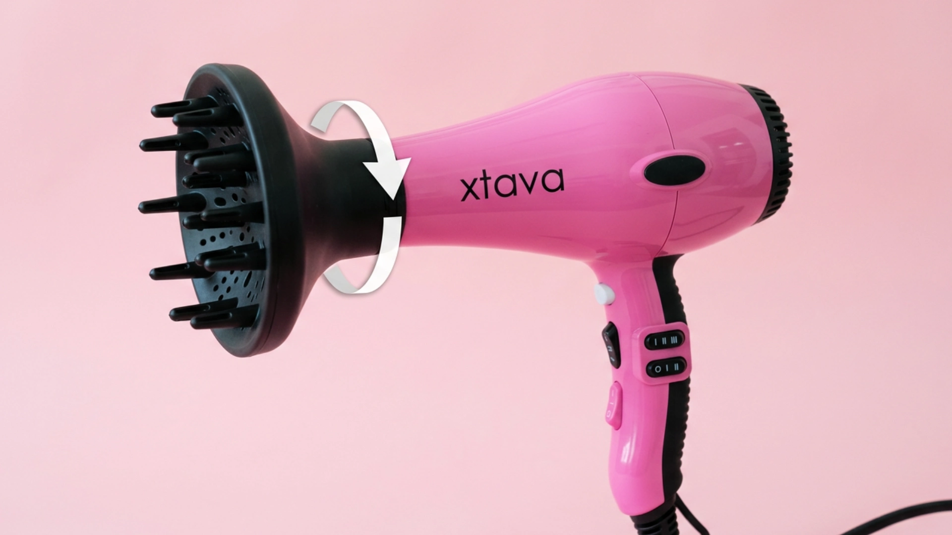 Pink Xtava hair dryer with diffuser attachment and airflow arrow