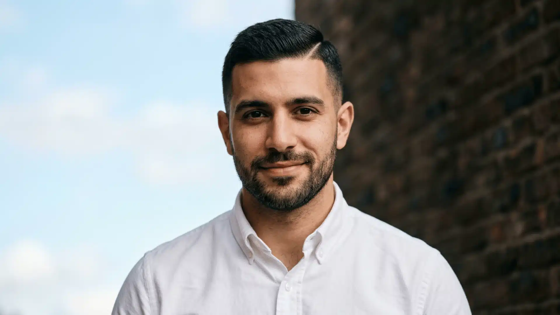 Professional man with an Ivy League buzz cut featuring a combable side parted top