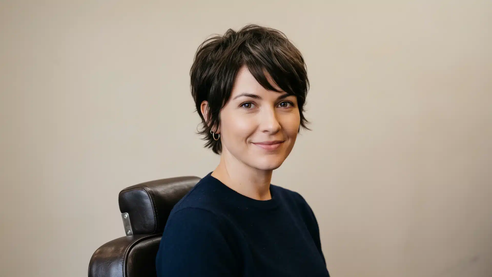 Textured pixie cut with soft layers that reduce facial length.