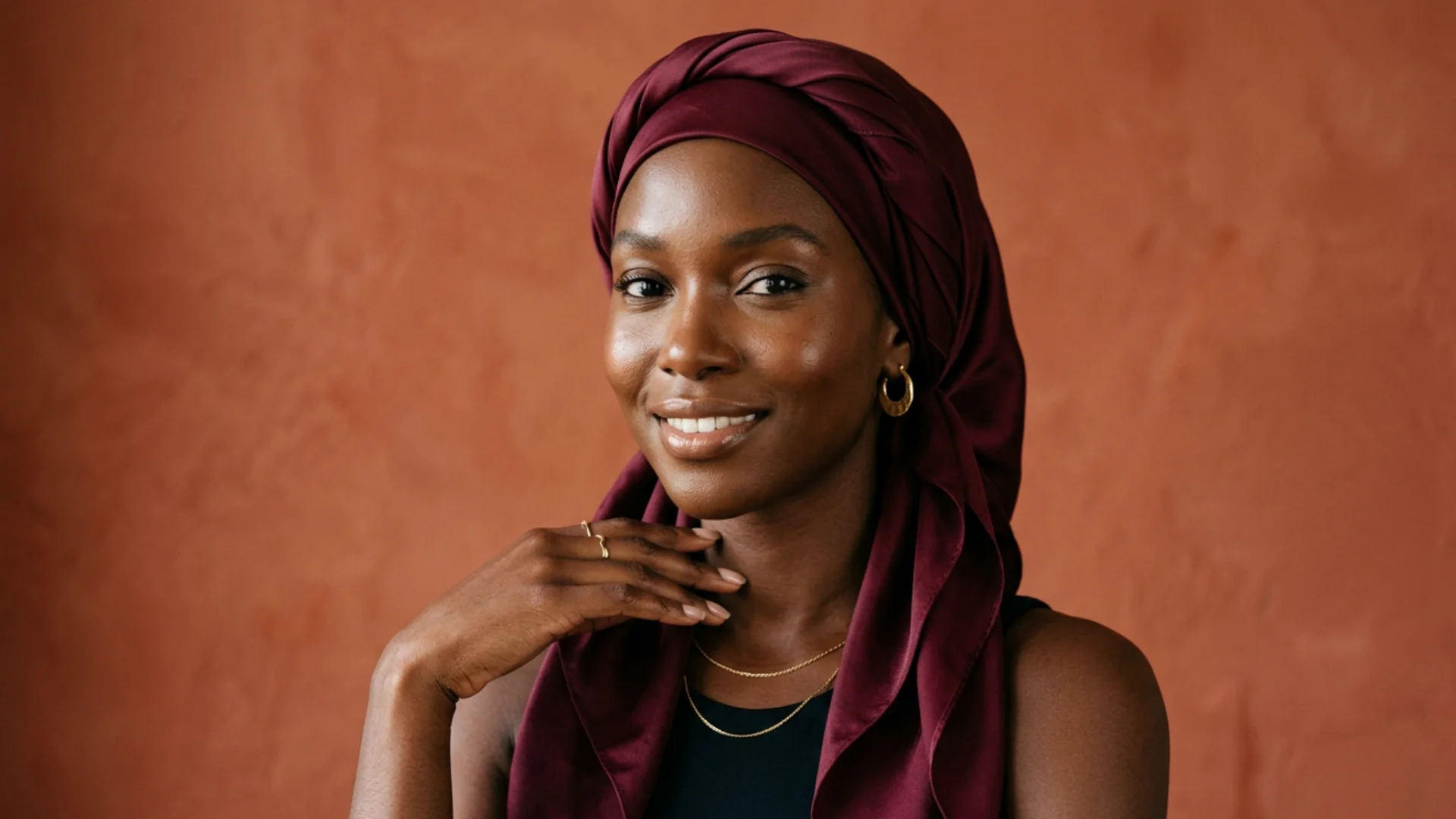 Woman wearing silk scarf wrap for sleeping hair protection