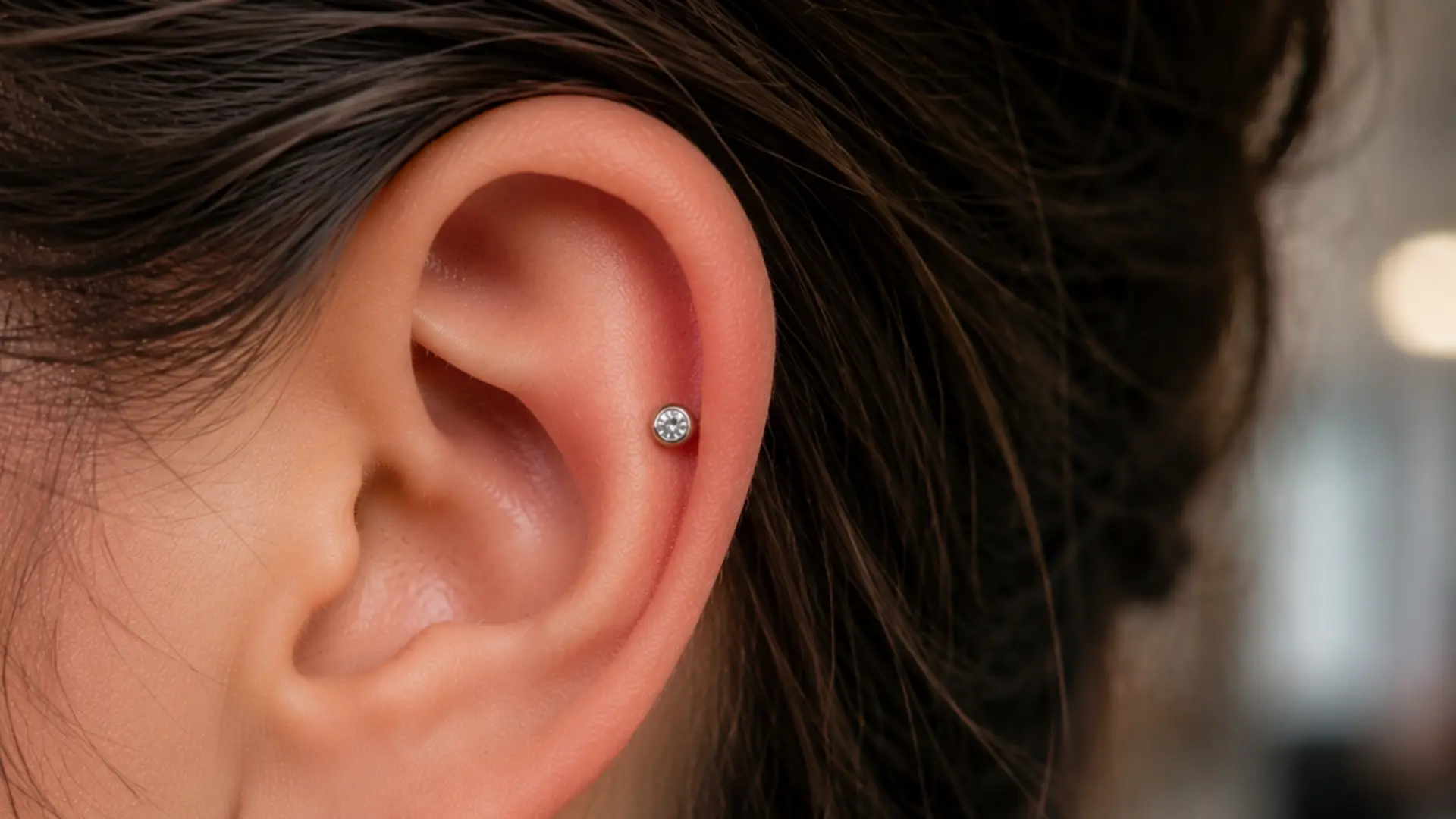 Anti-helix piercing with gemstone stud