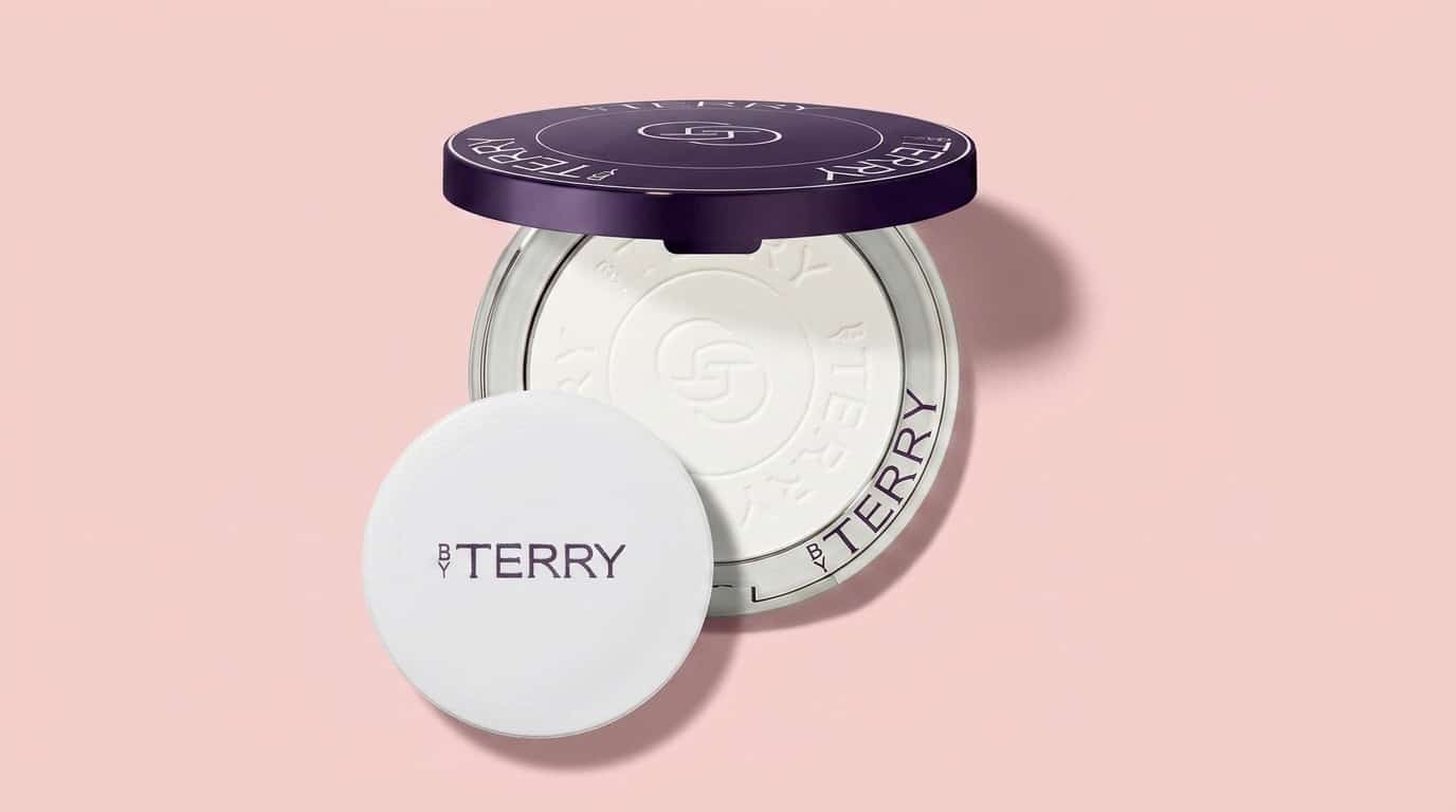 by terry hyaluronic pressed hydra powder shown in an open compact with a powder puff