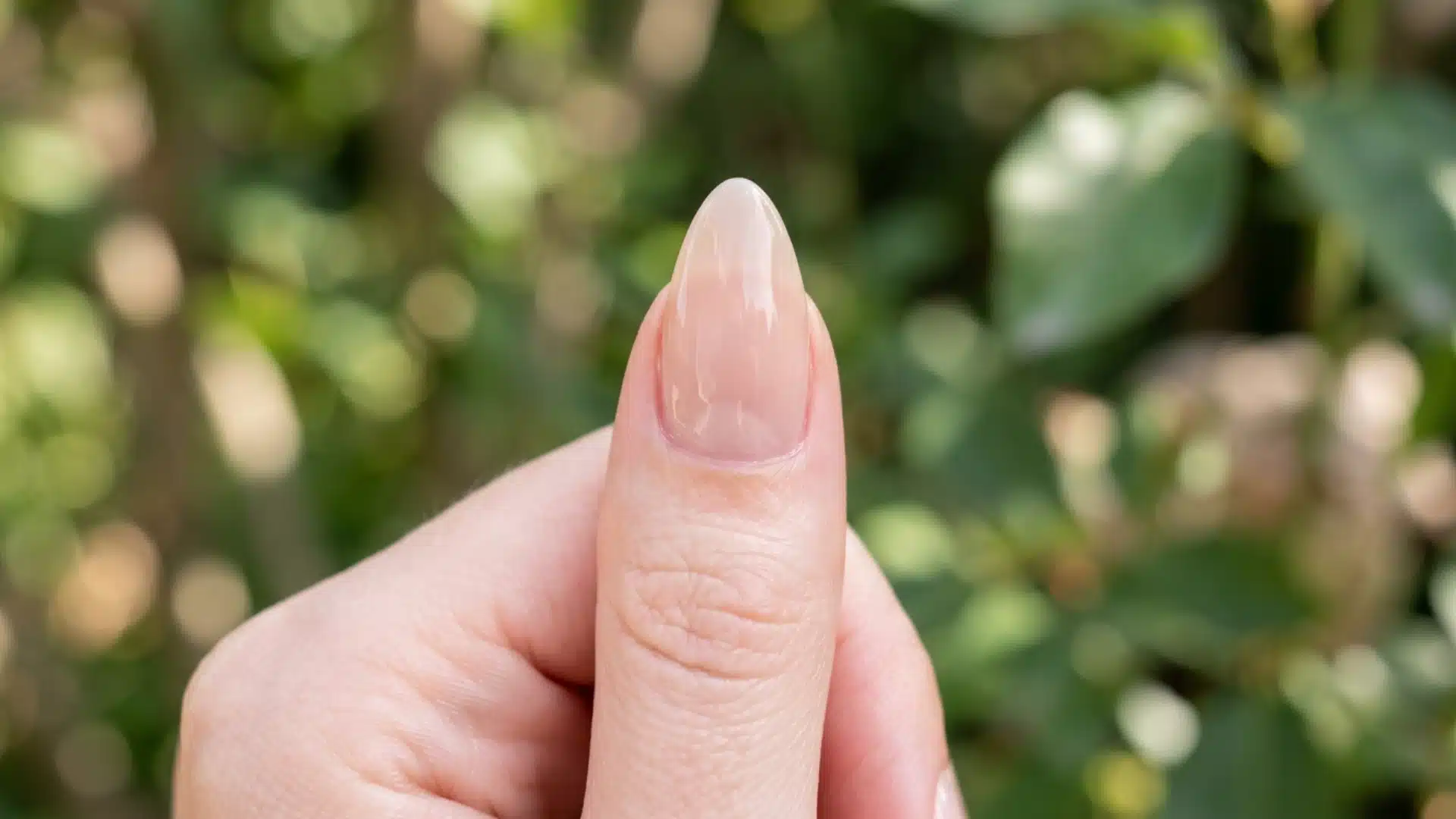Close-up of an almond nail shape with inward-tapered sides and soft pointed tip