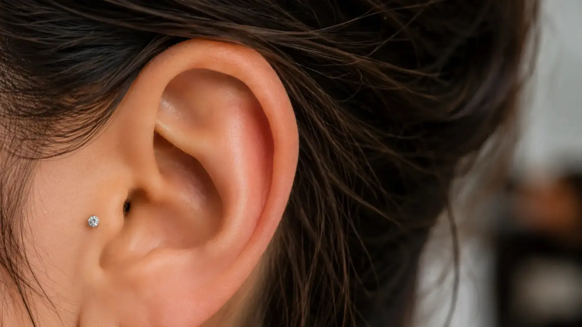 Diamond tragus ear piercing
