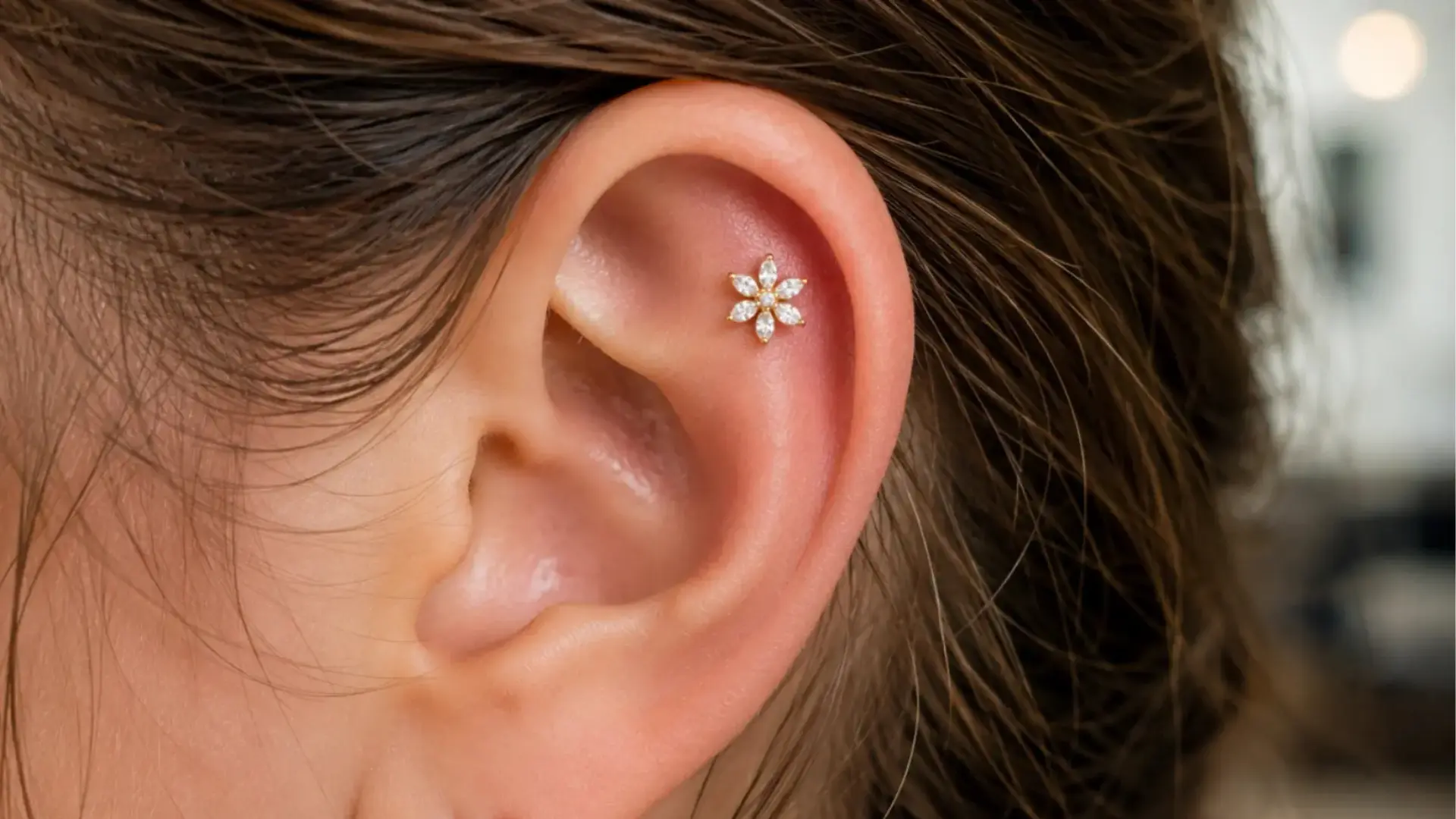 Flat cartilage piercing with floral stud