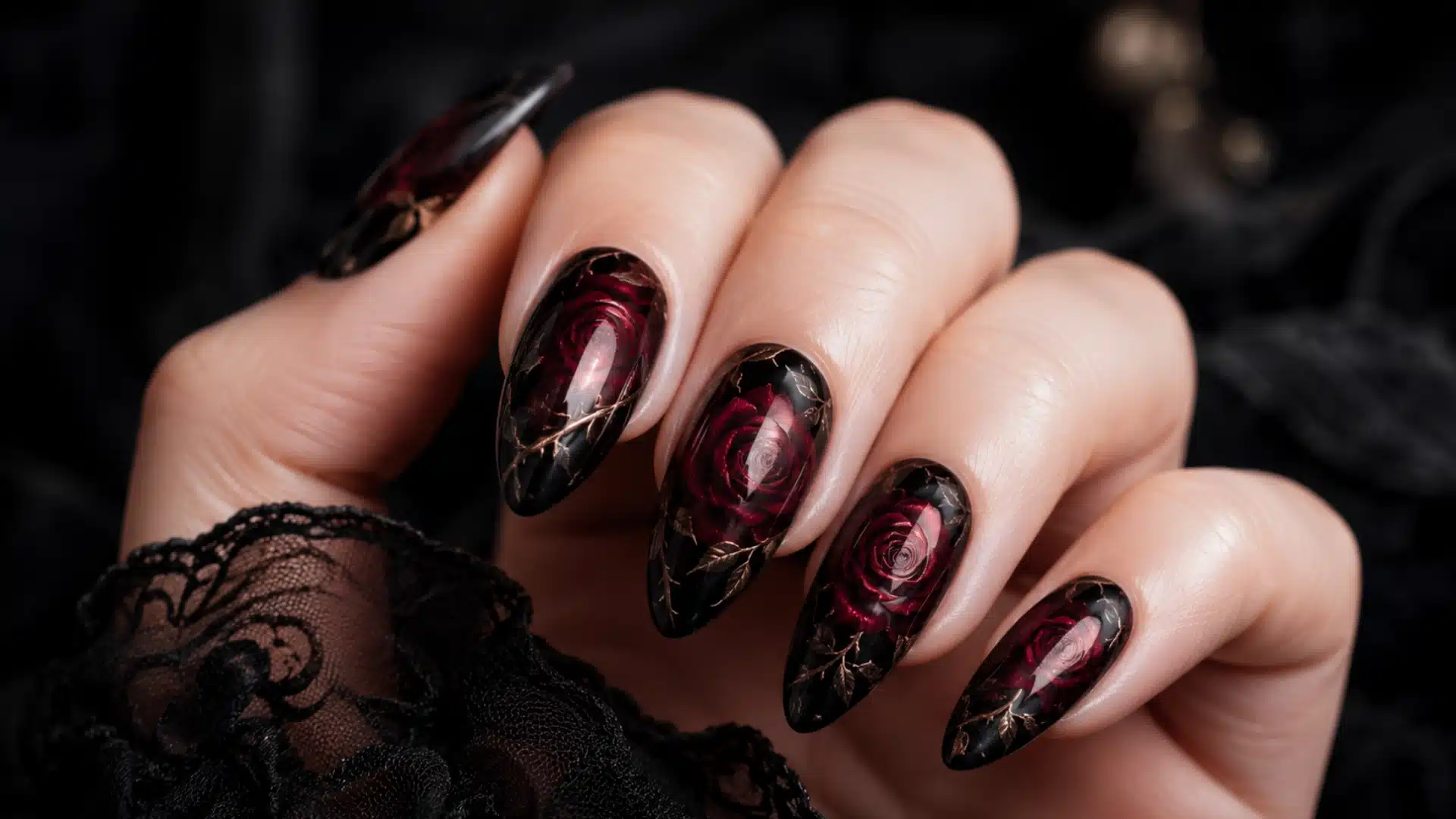 gothic rose almond nails with deep red floral art glossy black polish and soft black lace details