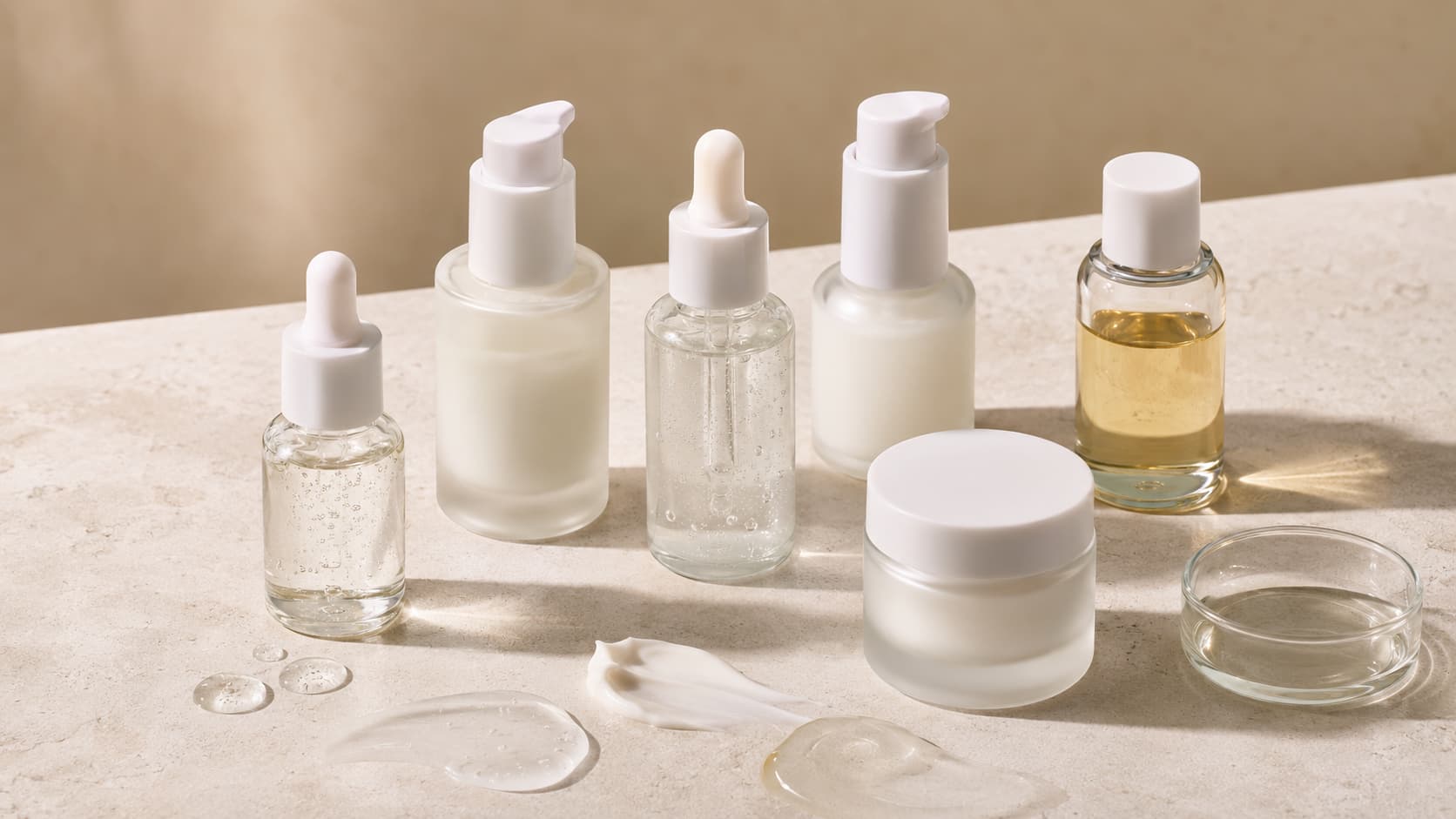hydration set showing simple moisturisers, oils and acids under a strong light